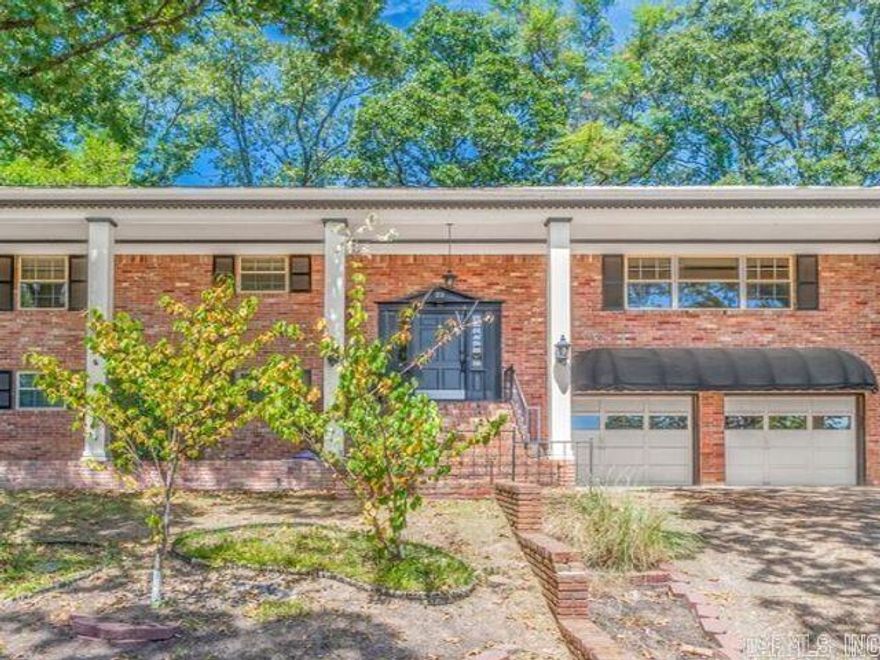Such wonderful curb appeal.  The welcoming front porch leads into split level with large family room, huge windows with great natural lighting.  Dining room and eat-in kitchen with breakfast bar. Primary suite has lots of room and second bedroom as well. Downstairs laundry and three more bedrooms makes enough space for in laws quarters, game room, teenager's dream or a large family's needs.  Big fenced backyard, 2 car garage and outdoor storage building.  So much to offer!