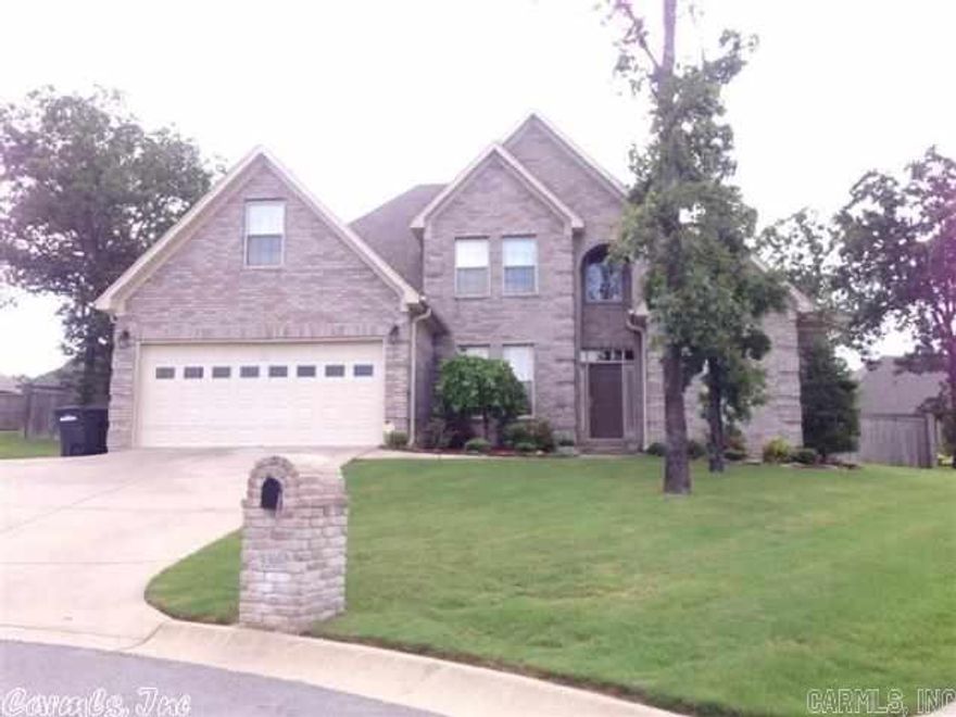 Spacious 4 or 5 bedroom home features bath for each bedroom, walk-in closets, and lots of space.Master suite is located on first floor and all others on 2nd. Home has been updated with new carpet and paint and is move-in ready. Kitchen is very spacious and open to living area. Backyard is fenced and level with a covered patio.Owner has just added beautiful french doors to dining area for flexibility as dining or private office space. Great home for large family and entertaining space.