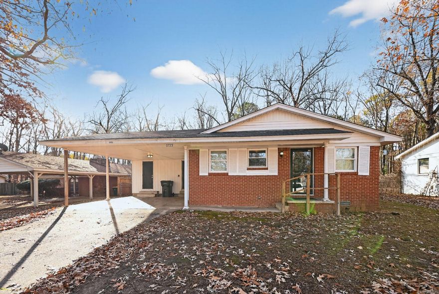 This charming all-brick ranch offers comfortable one-level living with a classic layout and thoughtful updates throughout. Inside, you'll find freshly painted interiors, a mix of refinished hardwood and durable LVP flooring, and a light-filled living area that opens into a spacious kitchen with wood cabinetry and a gas range. The home includes four well-proportioned bedrooms, two full bathrooms—one with a tub/shower combo and the other with a tiled walk-in shower—and a dedicated laundry area. Outside, enjoy a large wooded backyard, covered carport parking, and a cozy front porch. This move-in ready home is ideal for low-maintenance living in a peaceful setting.