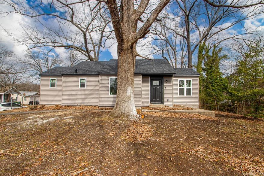 Nearly brand-new, this home has been meticulously renovated down to the studs, presenting a charming one-level residence on a coveted corner lot. An expansive living area flows seamlessly into a gourmet kitchen, outfitted with all-new stainless steel appliances, pantry and exquisite granite countertops that extend gracefully into the dining area. Two generously sized bedrooms complement a shared bathroom featuring a stylish shower/tub ensemble with glass sliding doors. A versatile bonus room offers the potential to become a third bedroom—with the addition of a closet—or an inviting office or sunroom. Throughout, luxurious vinyl flooring enhances the home's refined appeal. With a new HVAC system, water heater, and roof, you can enjoy peace of mind for years to come. Partial fenced backyard and two dedicated parking pads add both privacy and convenience. Ideally suited for first-time home buyers or students, this exceptional property is perfectly located near UALR, hospitals, shopping and I-630. Additionally, 100% financing and grant opportunities are available for qualified buyers.