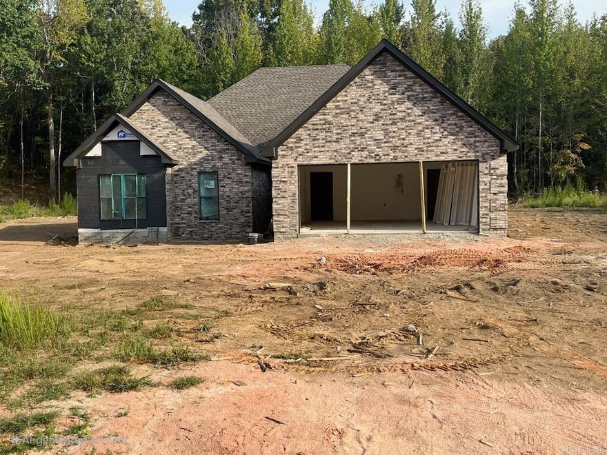 Distinctive Brick Exterior with Modern Style! This new 3 bedroom, 2 bath home offers a fresh take on country living just minutes from Brookland. The open floor plan highlights durable LVP and ceramic tile flooring, solid surface countertops, custom closets, and an upgraded appliance package. A richly toned brick exterior sets this home apart, while the back porch invites you to relax and enjoy the quiet setting. Located in the desirable Greene County Tech School District.