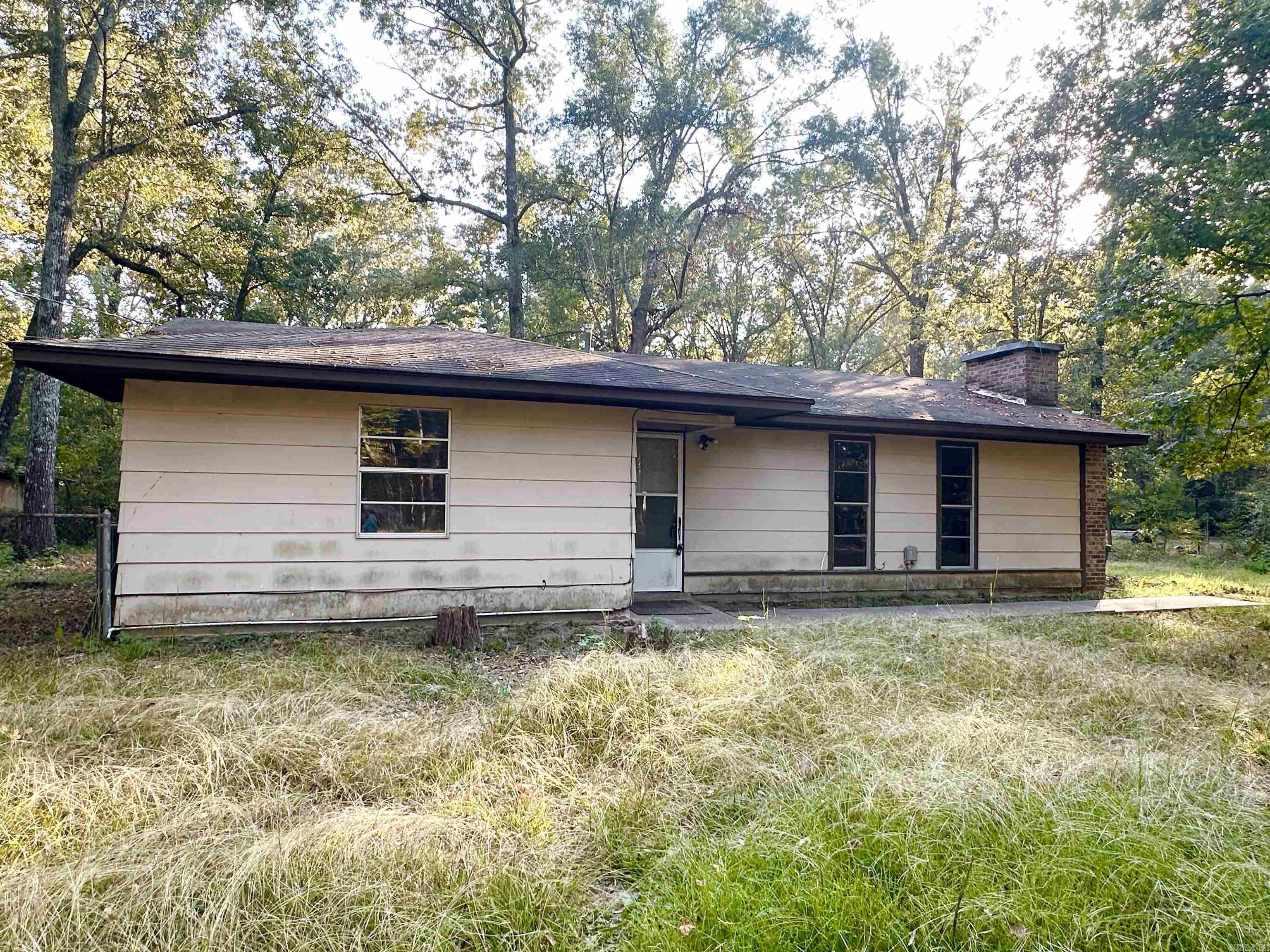 GREAT HOME WITH LOTS OF POTENTIAL LOCATED IN THE COUNTRY!! PERFECT Rental Property OR For a Small Family! Possible 3rd Bedroom (just needs closet), Fully Fenced in Back Yard with Covered Back Porch and Outside Storage Building, Natural Gas Available, TWO Closets in Master, Master Bath & Bedrooms Have Been Updated! Large Front Yard! Lots of Privacy - Located on a Dead-End Road.