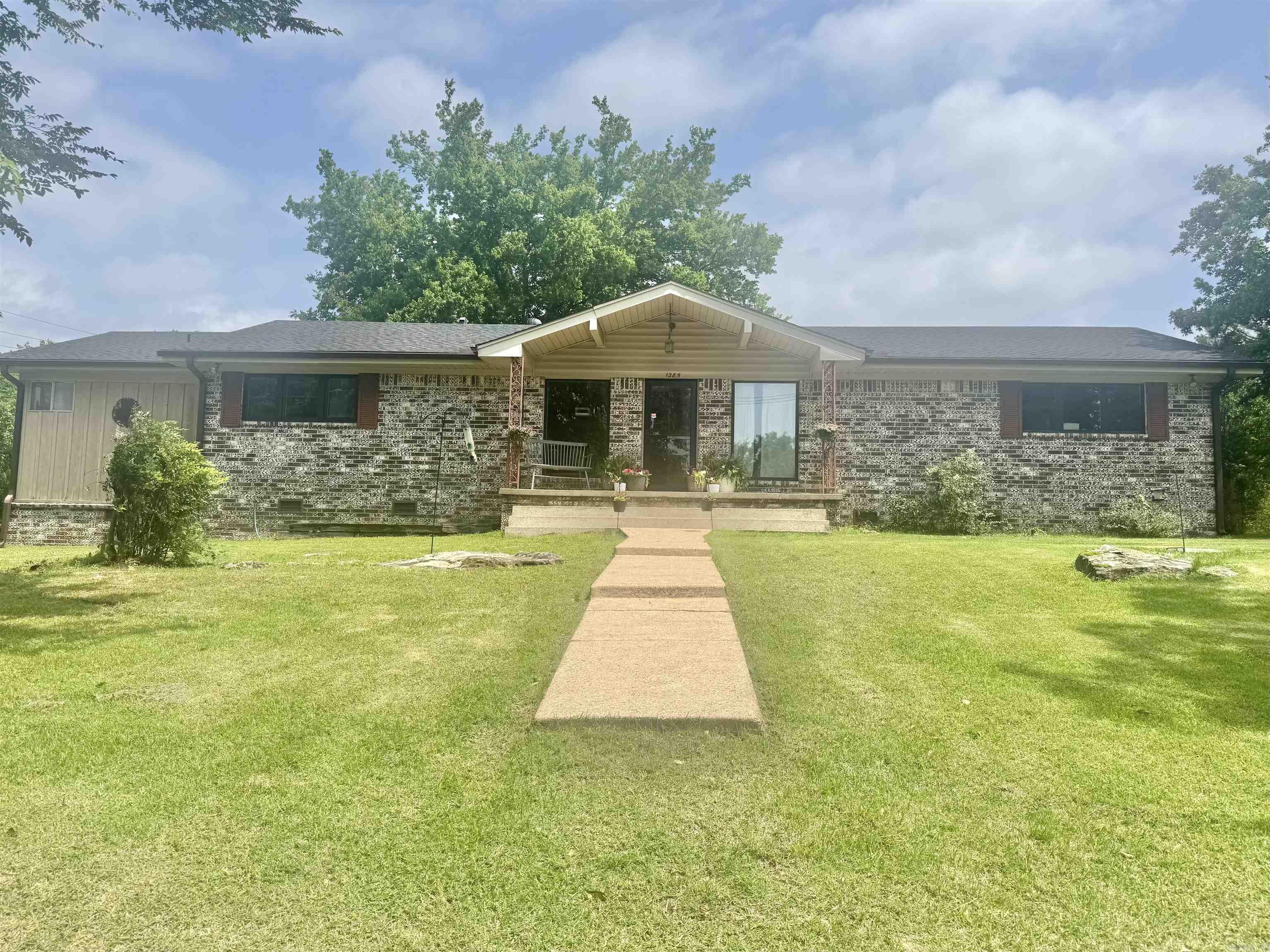 Classic Ranch home with 2710 sq. ft in the Heart of Batesville with ALL THE INTERIOR UPDATES ONE LOVES!! Within walking distance to Main Street and Kroger, this 4 bedroom, 3 Bath home has plenty of room for everyone. With an open concept and two living spaces, the double garage gives easy entry to the den with its own private suite providing extra privacy. The main living area is open to the foyer, and the the nicely updated kitchen with granite countertops and plenty of cabinet space for storage. This area has many options for additional customization to meet one's specific needs. Next to the kitchen and the main living area you will find a separate dining room and a nice sized butler's pantry/laundry space. On the opposite side of the main living, additional 3 bedrooms and 2 updated bathrooms provide additional functionality with comfort with style. There is also a SUNROOM just off the den that provides an additional 325 sq ft of space (not included in the total sq ft of this home) that has electricity and options to create that customized space one has always wanted. Per the seller: shingles were replaced in 2021. SELLER WILL PROVIDE A HOME WARRANTY WITH ACCEPTABLE OFFERS.