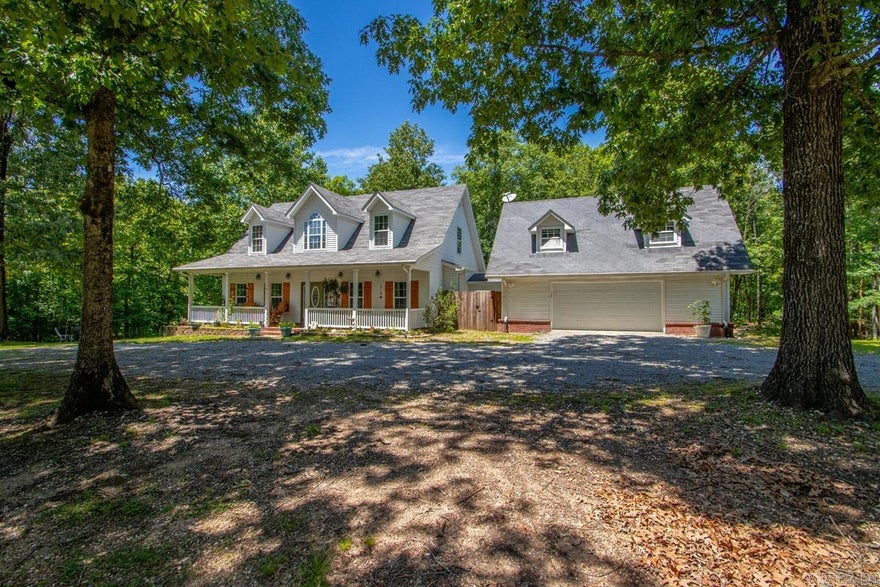 Nestled in a beautiful, peaceful neighborhood this property sits on 4.36 acres and backs up to a farm that covers both sides of the Saline River. The perfect blend of privacy and space, and modern updates. Nearly completely remodeled, the home features thoughtful upgrades throughout, creating a warm and inviting atmosphere for the moment you step inside. The beautifully updated kitchen is a true centerpiece, complete with spacious island featuring convenient storage underneath and pull-out cabinetry designed for functionality. A unique focal point is the fireplace, which features a hidden storage area behind it. Creative touch that adds functionality to the living space. Animal lovers will especially appreciate the thoughtfully designed, dedicated outdoor area. In addition to the main living space, the property includes an incredible opportunity for expansion with approximately 424 sq. ft. of potential living area above the garage. Already plumbed featuring a tub/shower, just needs some finishing touches to make it ideal for guest space, home office, game room, or private retreat.