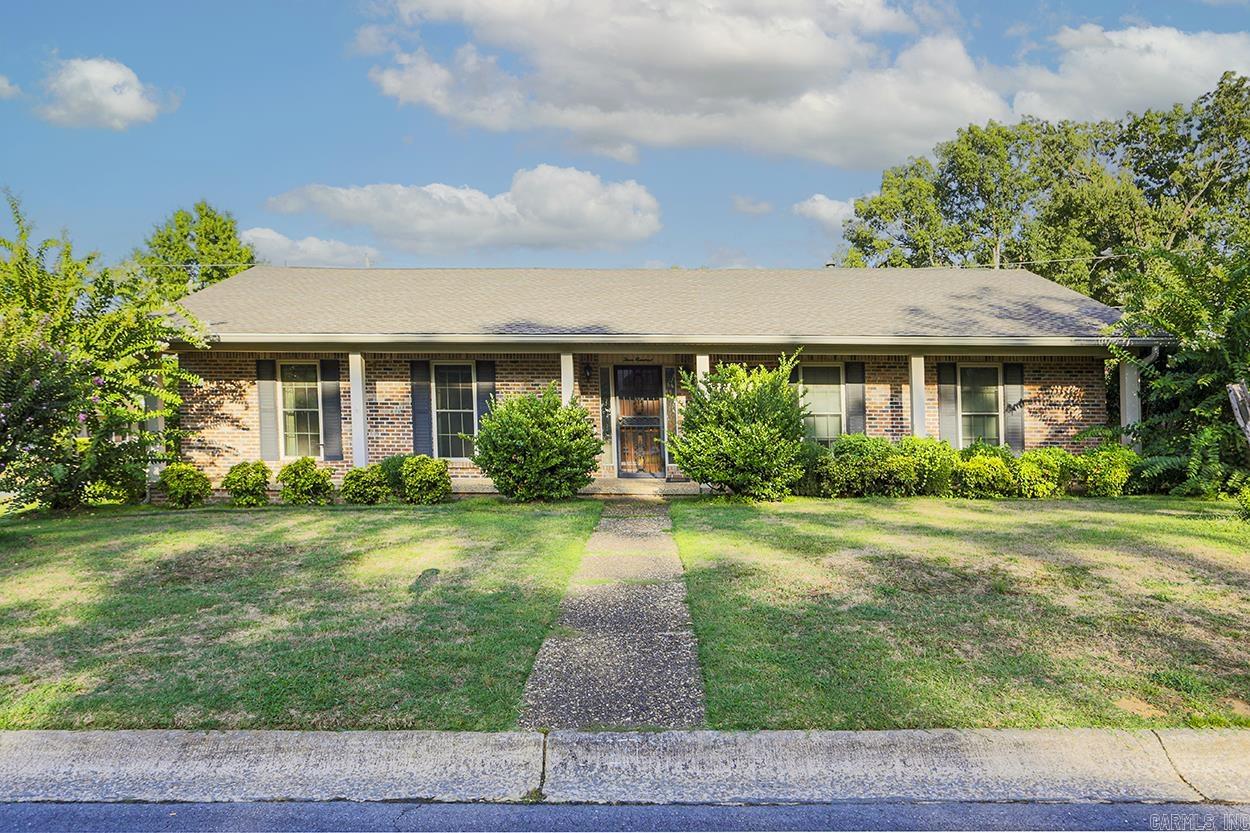 Wonderful, welcoming all brick, spacious home on a corner lot. All the big upgrades have been made, new roof, new HVAC, new water heater and new flooring. Spacious family room with dramatic rock fireplace, real wood paneling and a vaulted ceiling. Functional layout with formal living and dining rooms, plus eat in kitchen. Three bedrooms and two baths, primary bedroom has a walk-in closet with attic access. Donāt miss the little craft area between the kitchen and garage. On the outside of the two car, side loading garage there is a perfect home office or guest suite with its own bathroom. The living room opens to a back patio that overlooks the flat yard and pool area. The yard is fully fenced with a brick fence and has a separate storage building. This great house is waiting on you to come make it yours. Agents, please see remarks