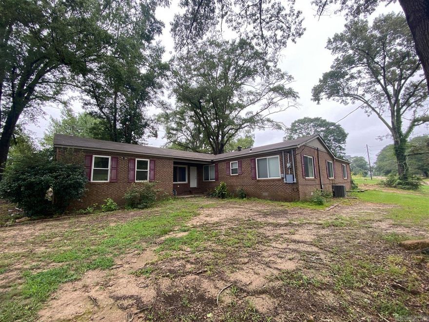 Brick home with many interior updates! Sitting on just under an acre, this home features spacious living areas, newer appliances, newer roof, fireplace, and generous laundry area.    Square footage taken from appraiser's report.    Lot size and tax amounts taken from courthouse records.