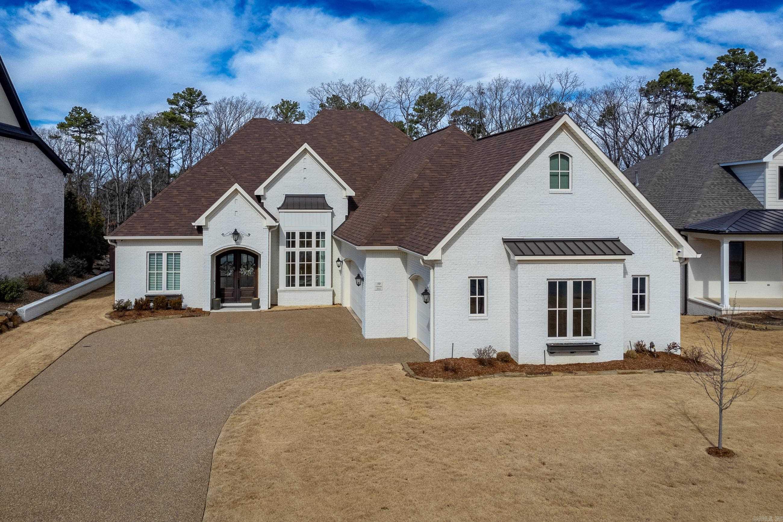 Chenal Valley Show Stopper!! Located in coveted Falstone court, this home is the perfect blend of luxury and comfort! Step inside and you will fall in love with the designer finishes that grace every corner. From the elegant foyer you are seamlessly connected to the beautiful dining, living and kitchen which offers an abundance of space for both living and entertaining. The kitchen is a chef's dream - appointed with professional grade Fisher-Paykel appliances, slab (Taj Mahal pattern) quartzite counters, custom cabinets and a dry bar with beverage cooler. The elegant primary suite offers a luxury bathroom sanctuary w/ soaker tub, rain shower, and a MASSIVE closet that connects to the laundry room. Upstairs, you will find 2 bedrooms w/ jack & jill bath, a game room plus a bonus room. Other features include a main level en-suite guest quarters, split floor plan, ENTIRE HOME GENERATOR, covered outdoor patio that overlooks the woods of Chenal Valley. Book a showing today - you will NOT want to miss this amazing home!! Agents see remarks.