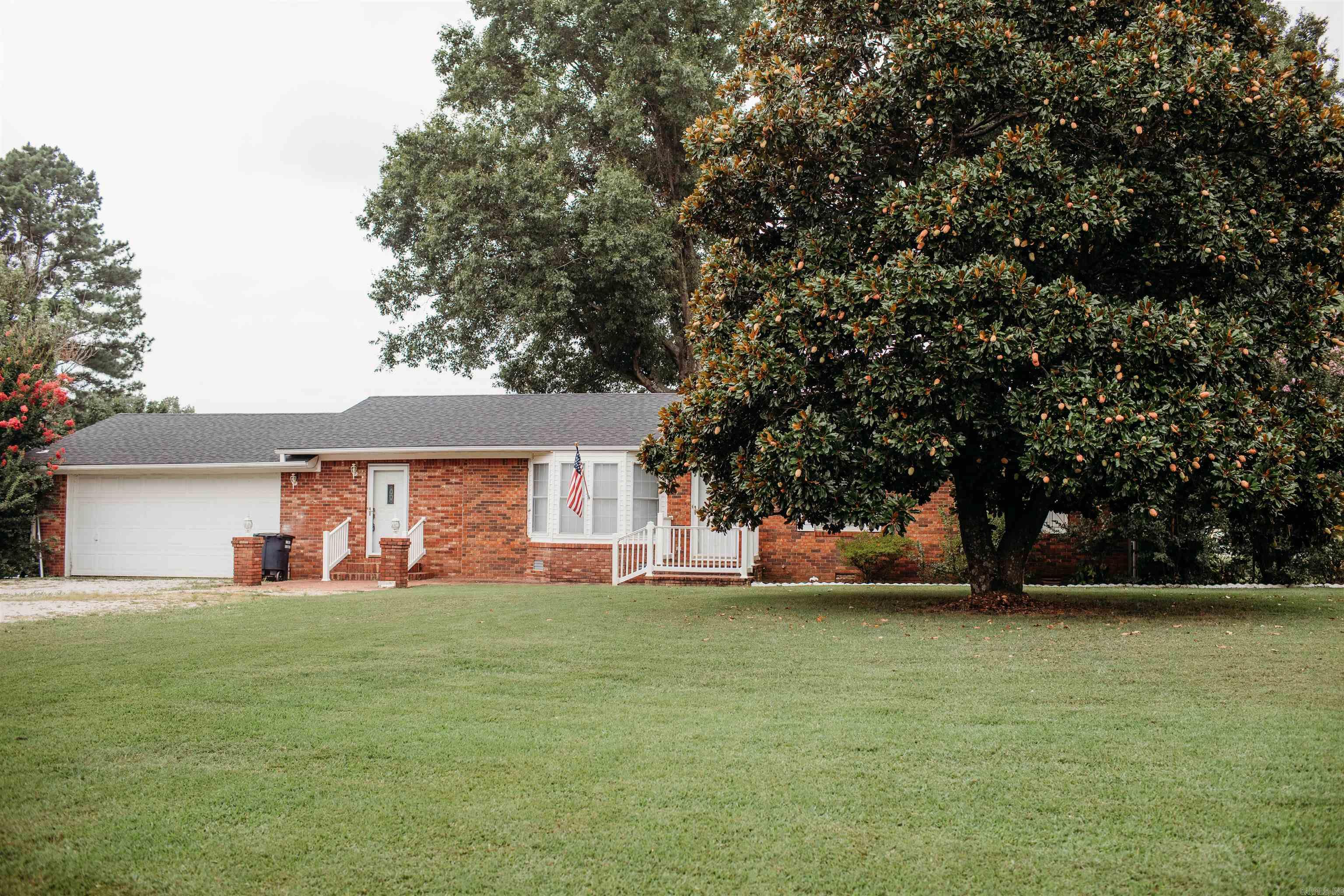 Beautifully Bricked home on a half-acre lot - 3 bedroom 2 bathroom brick beauty located on the skirts of Piggott! With ~ 1,556 square feet living space on a spacious lot, this property offers comfort, convenience, and room to grow. Built in 1973, the home retains its original charm with tasteful updates, including freshly painted walls, updated kitchen, and new roof that gives peace of mind for years to come. Two car garage with Loys of storage space! Step outside to enjoy the huge fenced backyard, perfect for kids, pets, or entertaining- with plenty of room to add a garden, pool or outdoor living area. Only One Owner has lived at this property!