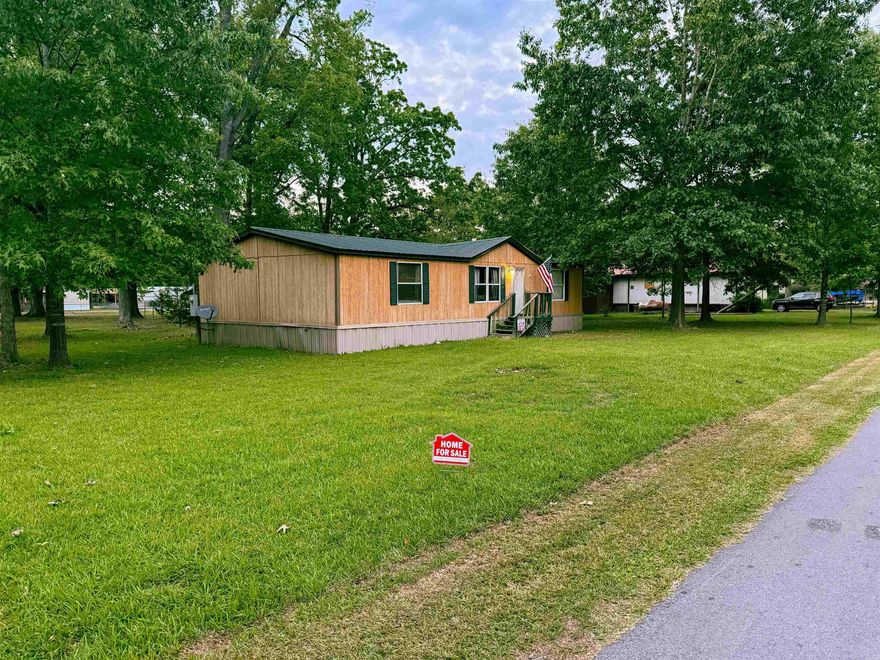 If you've been dreaming of an affordable getaway, fishing camp, retirement spot, or peaceful full-time home near the water...this one is worth a look! This 3 bedroom, 2 bathroom, 1344sq feet, on 6 lots - Block 38, level yard, and a new 3-ton HVAC unit installed in 2021. Plenty of room for boats, trailers, campers, outdoor entertaining & more. This property has been loved by the same owners since 2003 and has been the setting for years of family reunions, camping memories, laughter, and special moments. Now, it's ready for a new chapter.