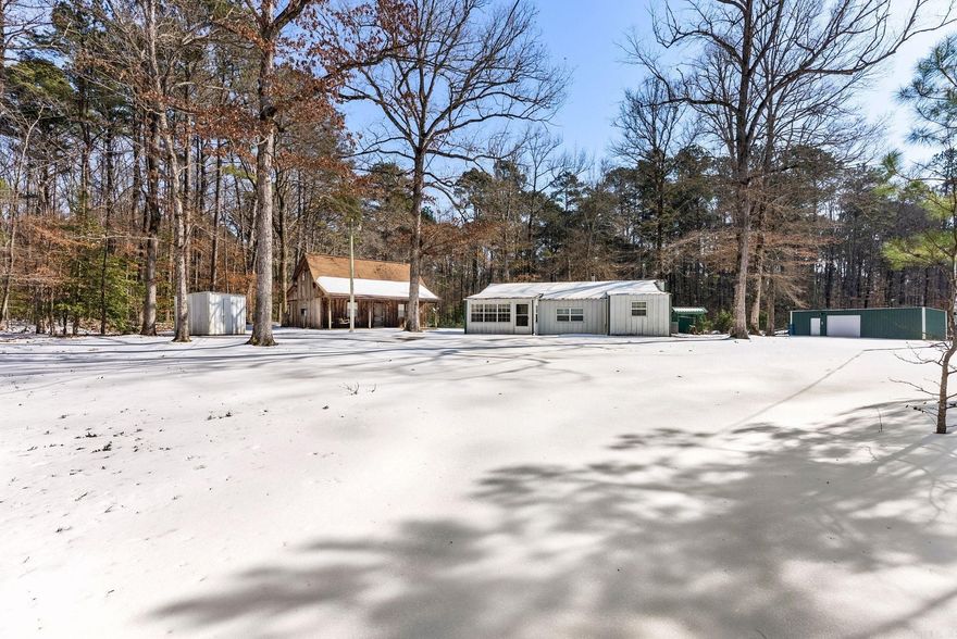 Discover the ultimate outdoorsman’s investment! This unique 7-acre property is strategically located for adventure, sitting just 3 miles from the Little Missouri public boat ramp, 18 miles from the world-famous Crater of Diamonds State Park, 30 miles from Caddo River canoeing, and 36 miles from the trophy fishing at Lake Greeson. The property features two fully equipped hunting cabins, a nice shop, and 7 ready-to-go RV hookups with water and electricity—offering immediate potential for rental income, a private hunting camp, or a family compound. The infrastructure is set up for the serious sportsman, including a dedicated cleaning station and ample storage for boats and ATVs. Whether you are looking for a basecamp for deer season or a commercial campground venture near Arkansas’ premier tourist attractions, the possibilities are endless. Property is being sold AS-IS.