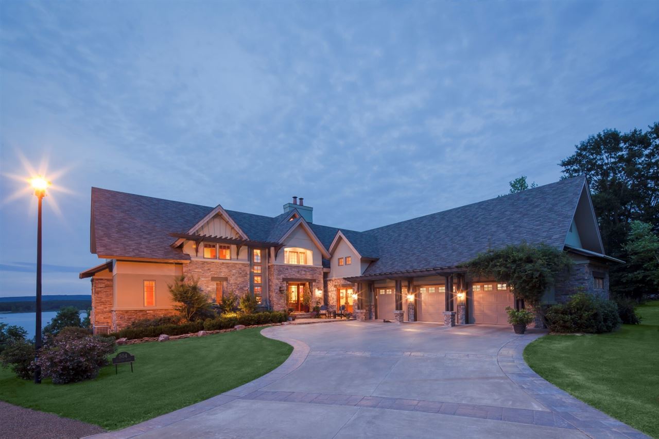 Not just a lake home in Heber Springs... THE lake home in Heber Springs! This amazing home was featured in Arkansas Life magazine and truly has some of the most gorgeous views of Greers Ferry Lake you will find. 5 bedrooms, 4 1/2 baths, 3 car garage, office, 2 fireplaces, walkout basement with its own living area, additional master suite, a bar and theater room.