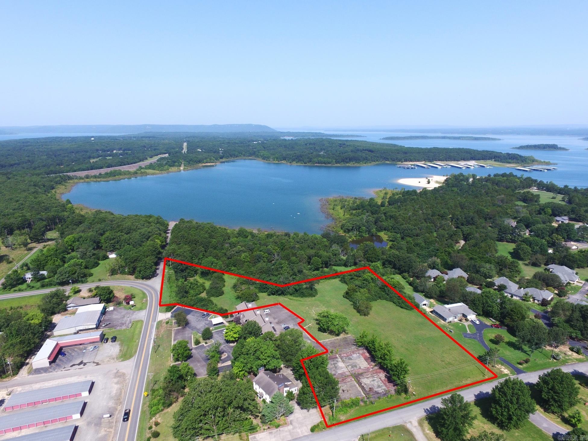Outstanding vacant land development opportunity on Greers Ferry Lake including approximately 5.13 acres (4.39 acres within right of ways). This is the closest lakefront property to Downtown Heber Springs and features 725 feet of frontage. (lines overlaid on photographs are approximate) Zoning is Rural Resort Residential and can accommodate a hotel, condos, RV park, apartments or residential homes. Water, electric and city sewer are on the property. Dream location!
