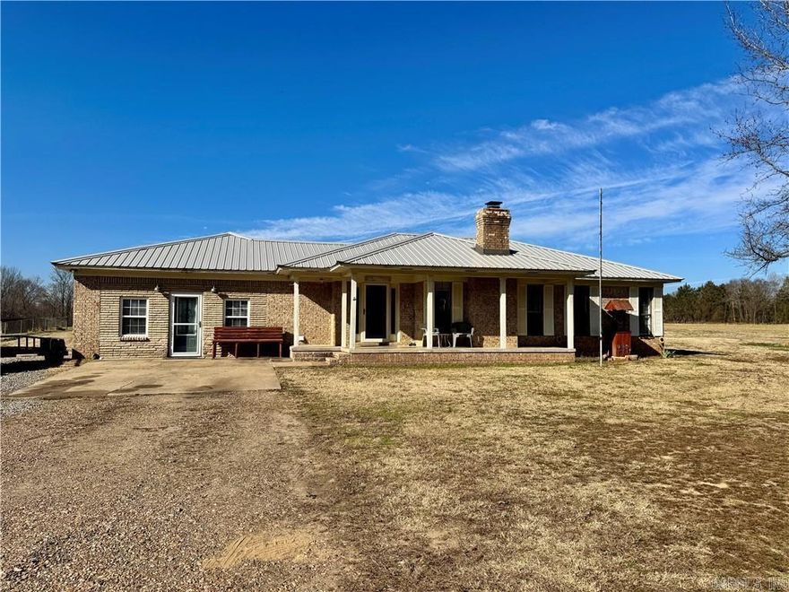 Space to spread out, room to breathe, and just minutes from town! This 2,400 SF home sits on two acres just outside the Atkins city limits, offering the perfect blend of country freedom and everyday convenience. Inside, you’ll love the flexibility of two spacious living areas, one featuring a charming rock, wood-burning fireplace perfect for cozy nights and gatherings, along with a large kitchen ideal for cooking and entertaining with loads of cabinets, generous counter space, and an oversized laundry room and pantry. A spacious flex room easily adapts as a home office, hobby space, playroom, or guest room, while all three bedrooms are generously sized for comfortable retreats. Major updates are already complete with a metal roof just one year old and an HVAC system approximately five years old. Outside, enjoy ample parking, room to roam, and a storm shelter, all just minutes from town and schools—offering the best of both worlds in space, comfort, and convenience.