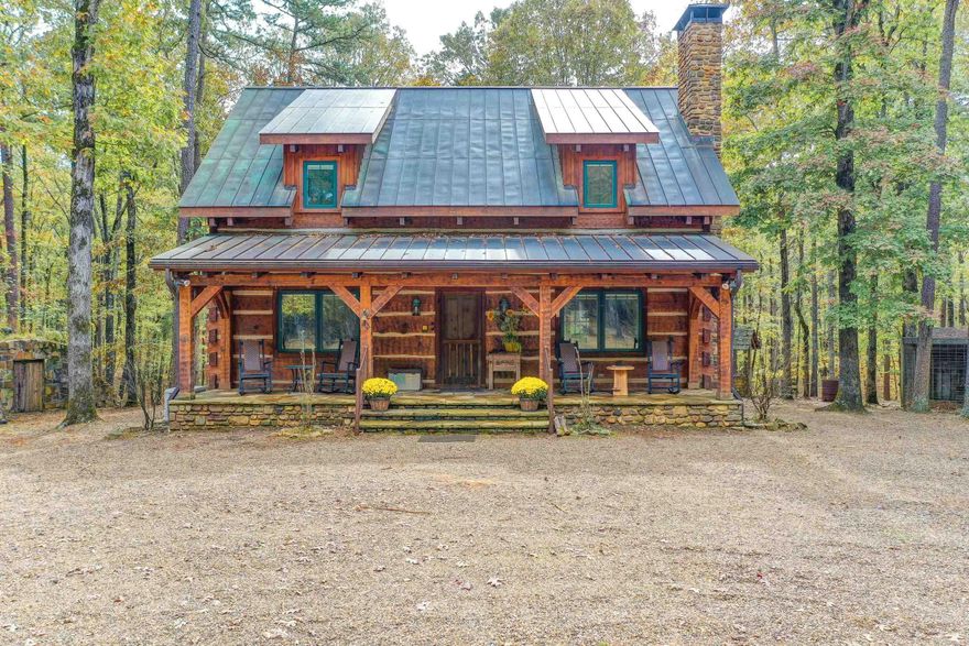 Private, gated 40+/- acre estate with no expense spared! 3 bed, 2 bath, 2450+/- sq ft luxury, custom hand hewn log home with copper roof. Pella windows, fireplace with exterior loader, generator & indoor gas grill. 2 car detached garage. Custom 50x50 ft barn with RV hookup fits 40' motor home plus areas to store tractors and other vehicles downstairs & generator. An elevator and set of stairs lead to a 1700+/- sq ft, beautiful 1 bed 1 bath apartment. 2 pole barns, storm shelter, coffee roaster, chicken coop, cold smoked smokehouse & much more!