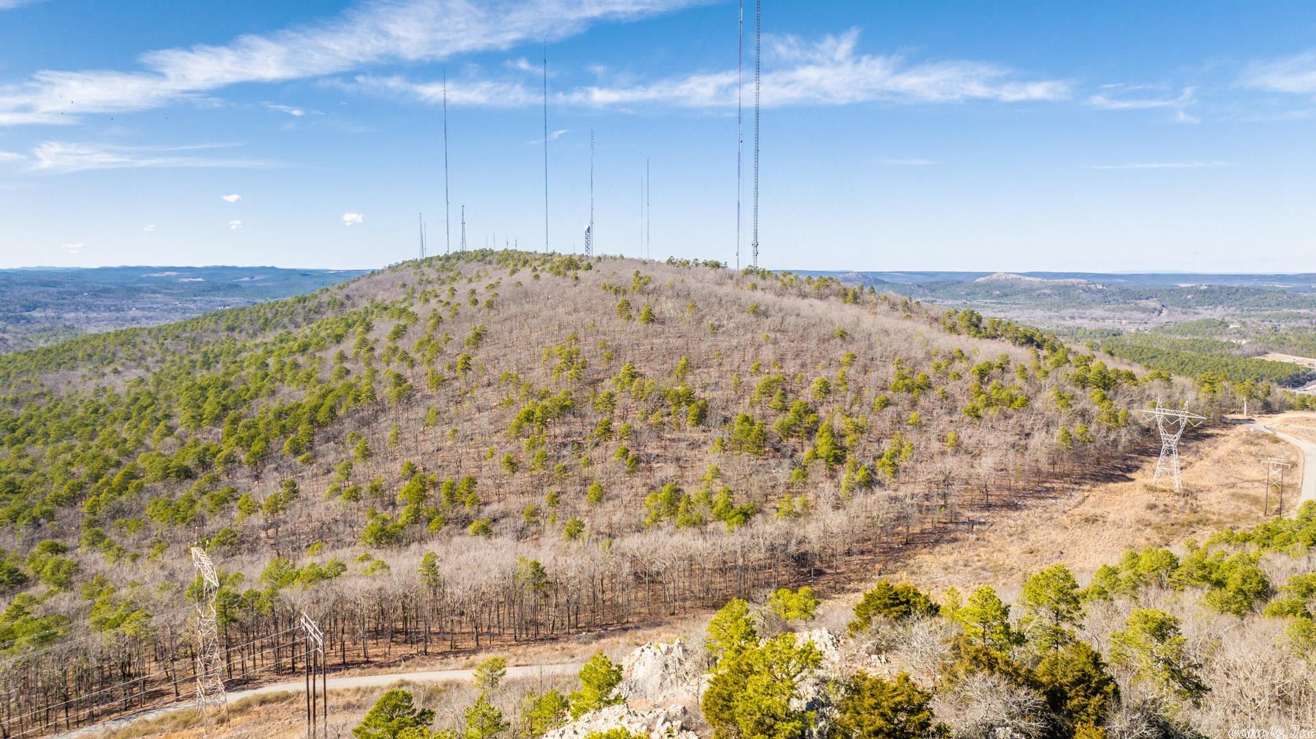This property is approximately 77 acres in West Little Rock in Chenal Valley. The property is accessed from Chenal Valley Drive and has about 1/4 mile of Gordon Road frontage. The new Bear Den Estates subdivision is immediately adjacent to the south. The tract offers multiple homesites with amazing views and excellent hiking and recreational opportunities in the heart of West Little Rock. It is conveniently located within 5 minutes of the Promenade on Chenal Parkway, Cantrell Road (Highway 10), and the Walmart SuperCenter on Chenal. It has fantastic views of Shinall Mountain, Pinnacle Mountain, Crystal Mountain, The Arkansas River, and Bear Den Golf Course.