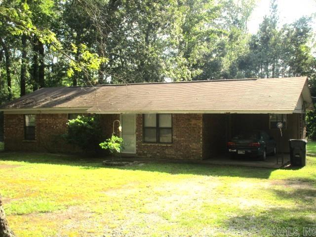 Great starter home, outside of city limits. Brick home on .899 acres. Almost at the end of a dead end road. This 3 bedroom, 1 bath home has beautiful newer cabinets in the kitchen. Large laundry room. Electric fireplace, carport and great storage building. All this awaits its new owners!!! Refrigerator, Washer and Dryer will convey with the home. Taxes are after Homestead Credit!! Home is being sold "AS IS". Call today to tour this home.