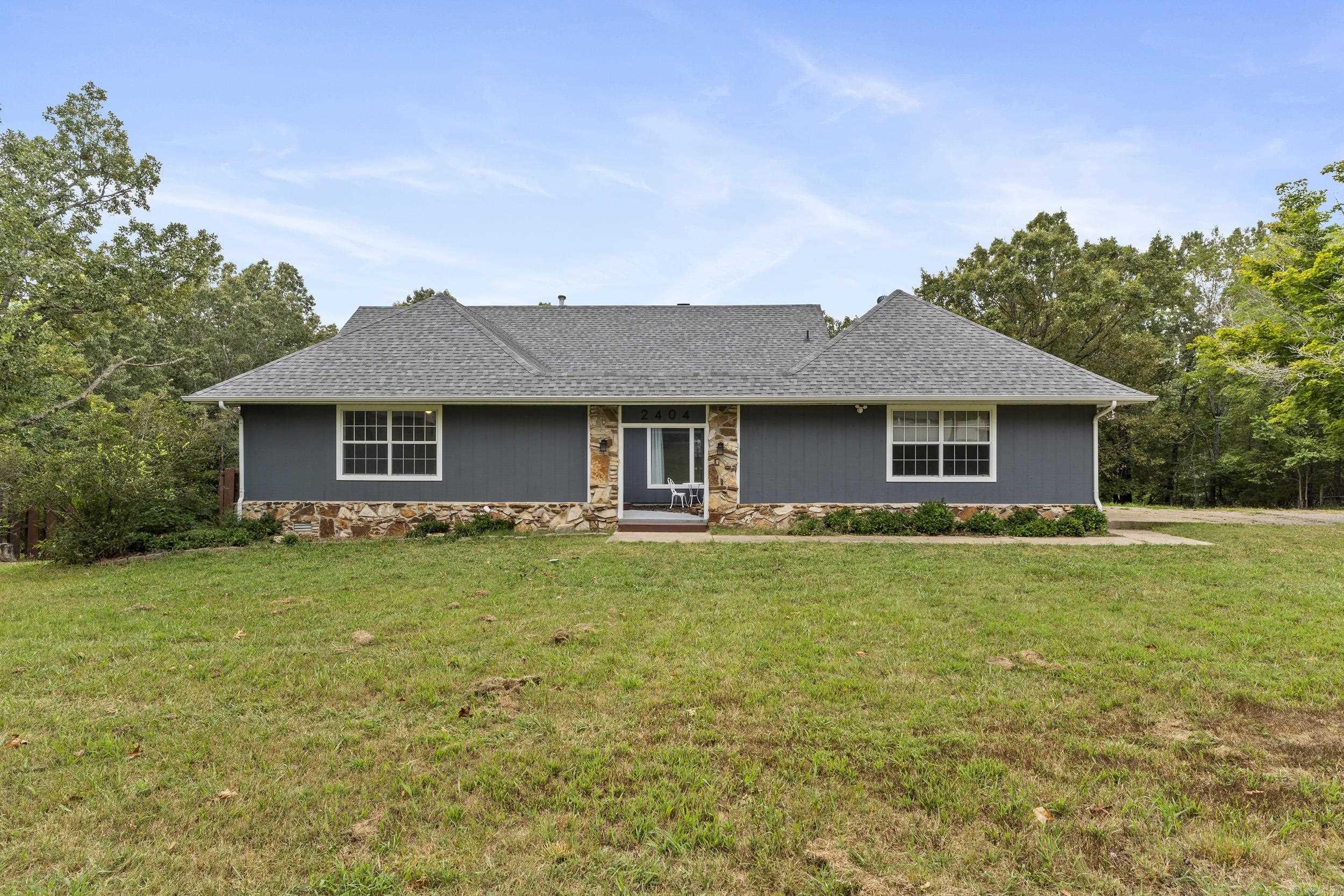 Completely renovated 5 bed, 2.5 bath, three-level home on 2.5 acres just outside city limits. Features include a dual-sided fireplace, stainless appliances, updated cabinetry, and sliding doors to a covered wraparound deck with scenic views. Multiple living spaces include a family room, dining room with waterfall courtyard view, and a lower-level great room with kitchenette and private entranceāideal for guests or multi-gen living. Layout offers 2 beds/1 bath on the main level, 2 beds/1 bath upstairs, plus 2 bonus rooms downstairs. Updates include new flooring, lighting, waterproofed basement, water filtration, water softener, and gutters. With no restrictions, ample parking, and a move-in ready interior, this property is perfect for families, entertaining, or quiet country living just minutes from restaurants, shopping, and medical facilities.