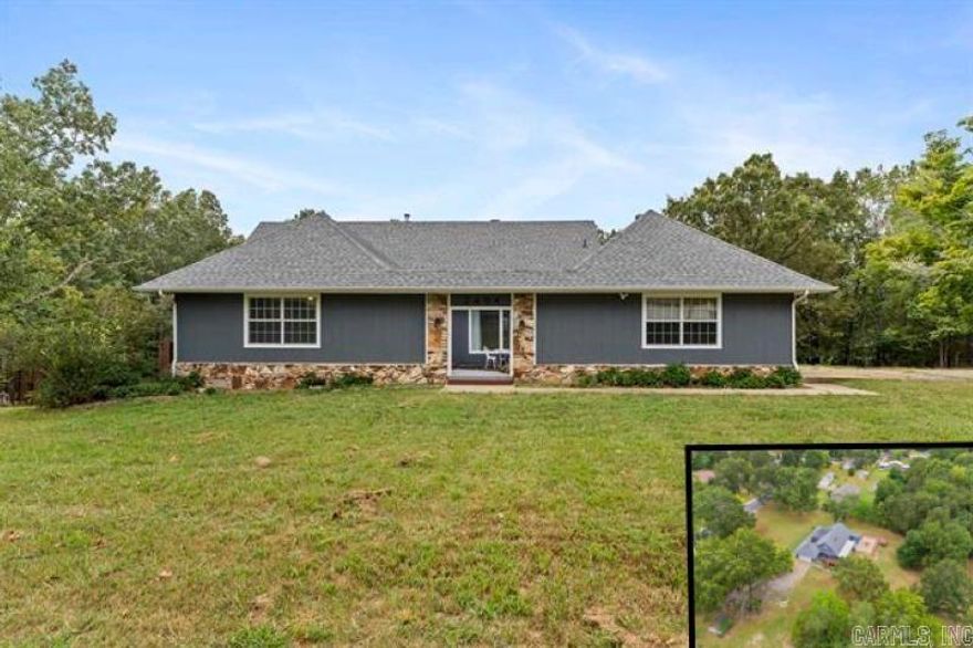 Completely renovated 5 bed, 2.5 bath, three-level home on 2.5 acres just outside city limits. Features include a dual-sided fireplace, stainless appliances, updated cabinetry, and sliding doors to a covered wraparound deck with scenic views. Multiple living spaces include a family room, dining room with waterfall courtyard view, and a lower-level great room with kitchenette and private entrance—ideal for guests or multi-gen living. Layout offers 2 beds/1 bath on the main level, 2 beds/1 bath upstairs, plus 2 bonus rooms downstairs. Updates include new flooring, lighting, waterproofed basement, water filtration, water softener, and gutters. With no restrictions, ample parking, and a move-in ready interior, this property is perfect for families, entertaining, or quiet country living just minutes from restaurants, shopping, and medical facilities.