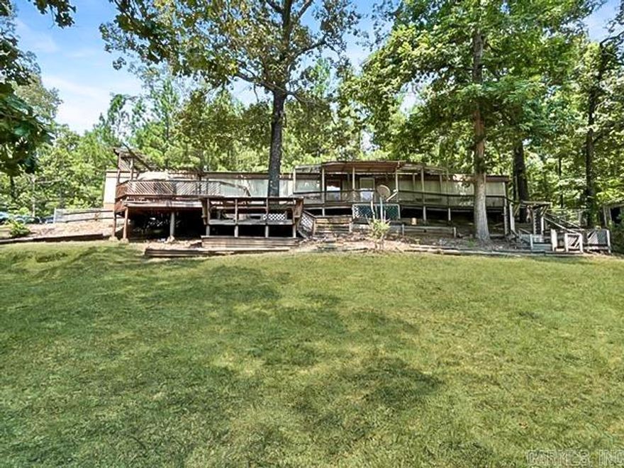 Affordable on Acreage! 3 bed 2 bath mobile home on 3 acres in Fountain Lake School District. Permanent foundation with brand new HVAC system, new fence, and a paved driveway. Appliances convey. Sold as is. Will need some work. AGENTS SEE REMARKS!