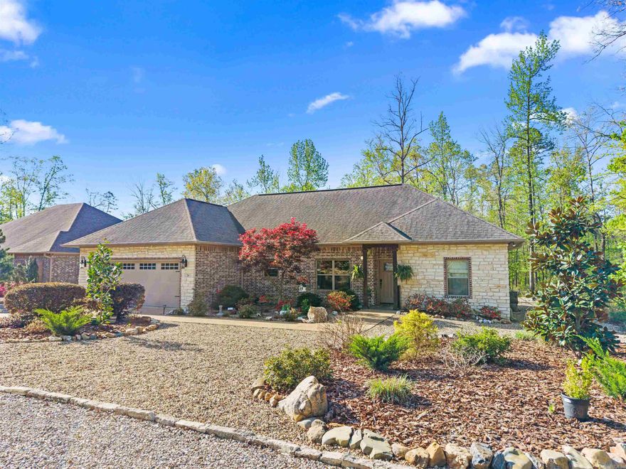 Welcome to your dream home in the heart of Hot Springs Village! This 3 bedroom, 2 bath house is an absolute gem, featuring a beautifully custom landscaped front lawn that's ready for you to move in. With its modern touches and elegant finishes, this home has everything you could want and more. Soft-close cabinets, granite countertop in kitchen, granite countertops in bathrooms. Extra pantry in the laundry room. Crown molding in the living room, dining room, and kitchen. Oversized garage with a wide garage door. The large primary suite is a real showstopper, boasting a stunning large tile shower and an enormous walk-in closet that leads to the laundry room for added convenience. You can savor the beauty of the changing seasons from your enclosed sunroom and cozy up to the fireplace inside. The location of this home is nothing short of ideal - you'll be situated near the Coronado Fitness Center, Glazepeau gate, and Walmart for the ultimate convenience. Welcome Home! There is a one-time buy-in fee of $2,000.00, payable to the Hot Springs Village POA for new buyers.