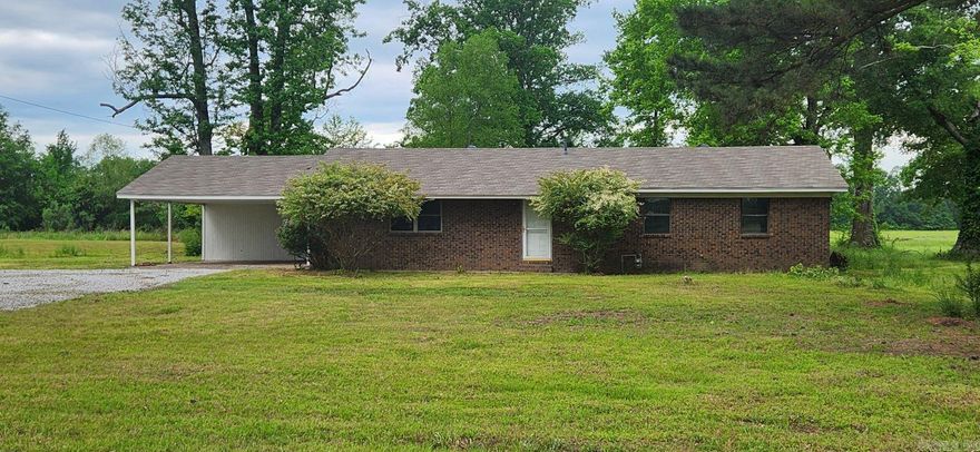 Nice 3/2 brick ranch style home sitting on 1.12 acres in such a great location, only  a couple of miles to the freeway, to the airport or to Walmart. Very large living room and great size eat in kitchen with new countertops and freshly painted cabinets. House has had most of the interior repainted recently, had new floor covering installed, and new vanities in the bathrooms. The seller had a new septic tank and new field lines installed. The rooms are great size and have good closet space. There is a large laundry room with a good size storage closet. There is a circle drive and the yard is huge and has a lot of road frontage. There is so much room here both inside and out. More acreage is available.