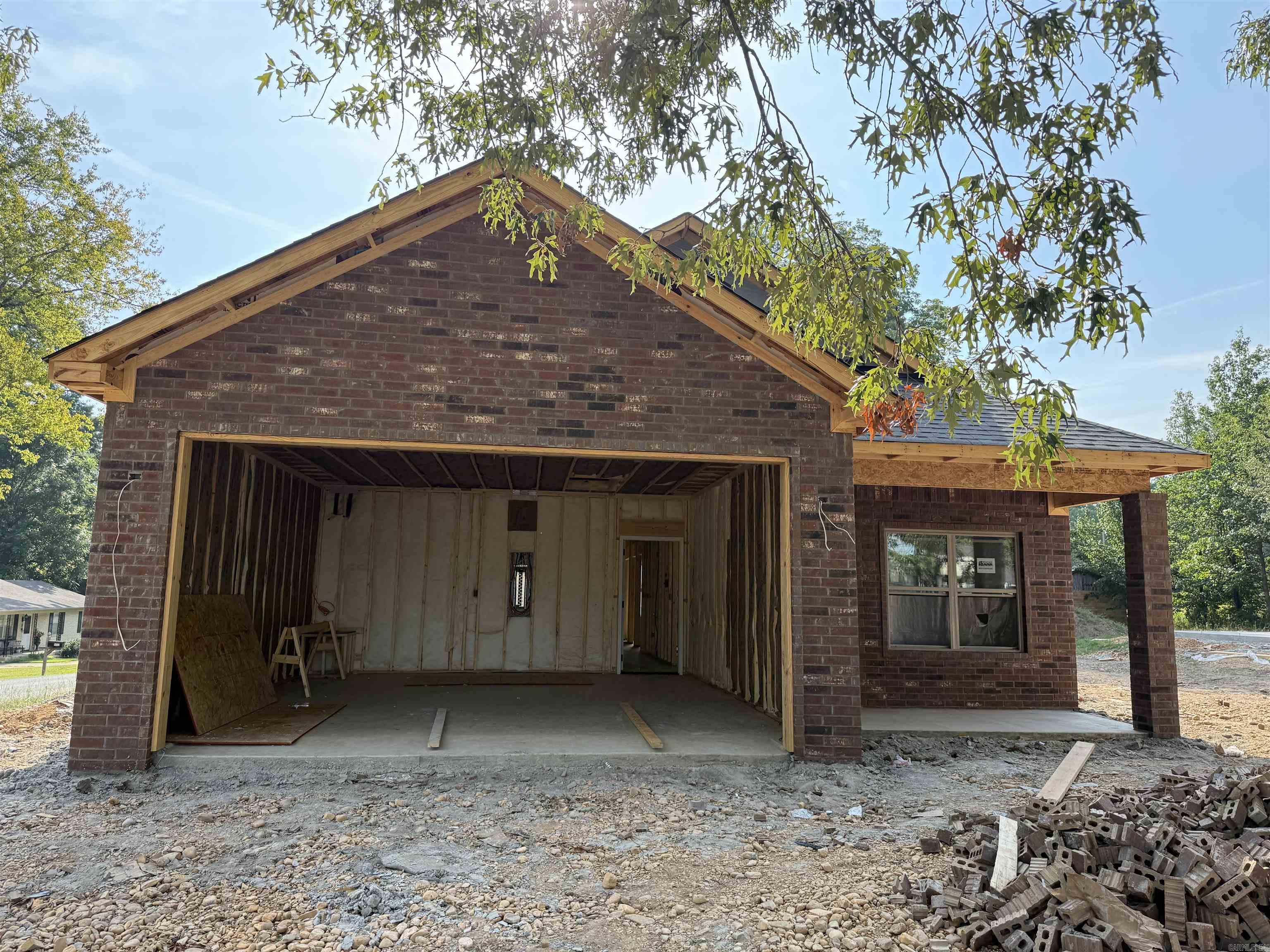 Showings to begin Friday, August 29, 2025. New all-brick construction on a level lot! This 3BR/2BA, 1,253 sq ft home offers a vaulted ceiling in the kitchen and living area, large pantry, granite countertops, and custom cabinetry. Each bedroom features a walk-in closet, plus thereās a spacious laundry room and two-car garage. Built with spray foam insulation for efficiency and a wheelchair-accessible design for convenience. Includes a 1-year builderās warrantyāmove-in ready (upon completion)!