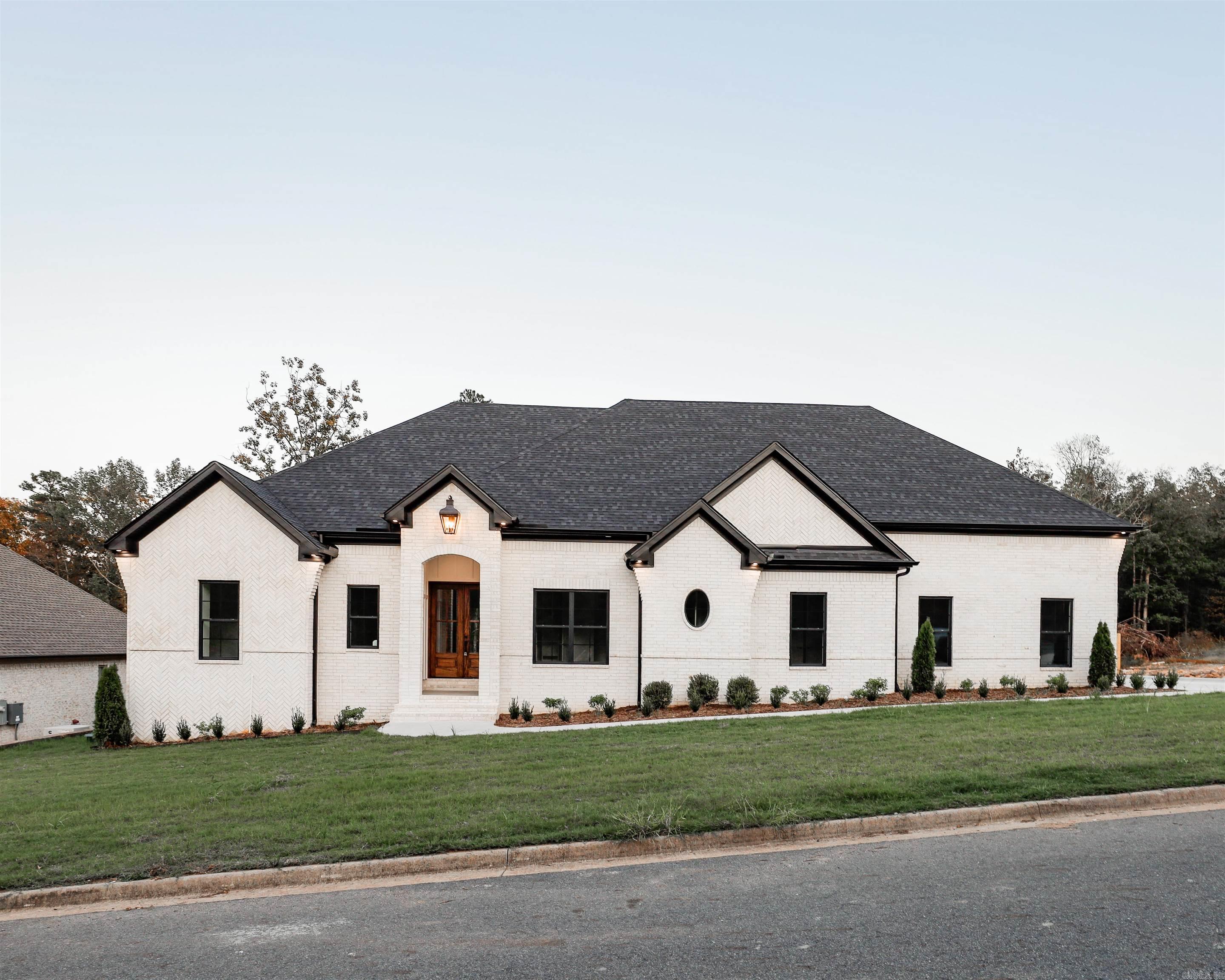 This open floor plan features 3 bedrooms/2 bathrooms downstairs with a large open living room, kitchen, dining area and large picture windows to showcase the greenery on the lot. Upstairs there is an additional bedroom, bathroom and large open living/flex area.