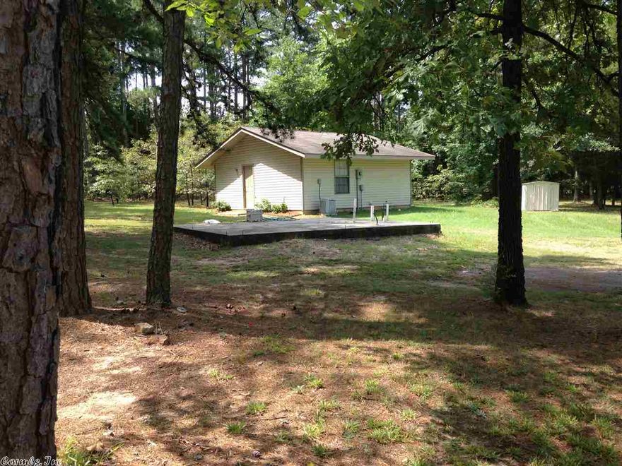 In CITY of Conway. Private,Cute little bungalow. Has additional slab w/plumbing to build a shop or storage bldg. Outside storage building.  All underground utilities. Covenants allow another home to be built on lot.  Refrigerator, Washer & Dryer convey. Home on Conway Corp water, but has a well also.