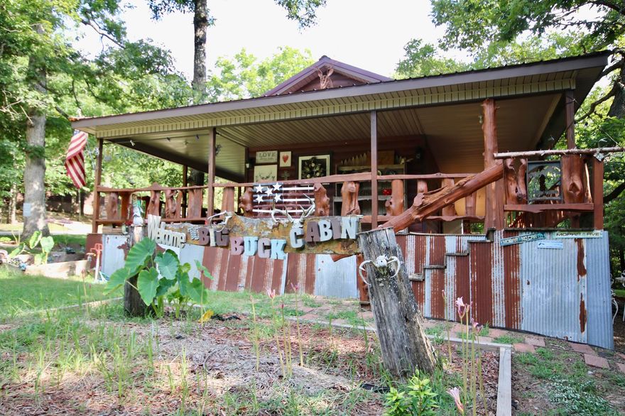 Welcome to this incredible investment and recreational oasis, an ideal Airbnb opportunity just a short drive from Prairie Grove. This turnkey property offers ultimate privacy and seclusion, making it the perfect retreat for nature lovers and those seeking a peaceful escape. The property boasts two separate homes that will convey completely furnished, providing convenience and comfort to your guests. The Big Buck Cabin features two bedrooms with two baths, adorned with custom woodwork throughout, emanating a rustic cabin feel. Its large wraparound porch with a custom railing and an outdoor gazebo with a fire pit and sitting area create the perfect setting for relaxation and outdoor gatherings. The Little Deer Cabin offers two bedrooms with one bath and a loft area, boasting custom woodwork and a covered back porch. It has its own outdoor space, complete with a fire pit, making it an ideal spot for families and friends to enjoy quality time together. Additionally, the property includes a spacious shop building with two bay doors and a heated/cooled office, presenting an excellent opportunity for various projects and potential income streams. Seller requests 24 hr notice for showing.