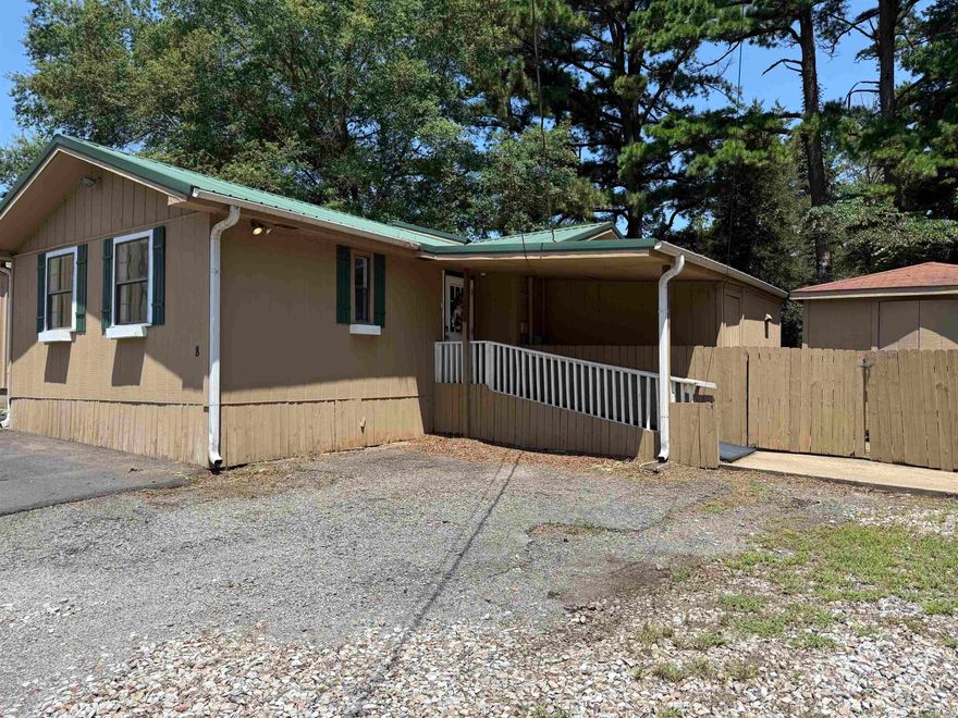 AGENT OWNED PROPERTY:  No Zoning Restrictions! Check out this unique property with endless possibilities!Property is located on a corner lot and features a large parking area that is partially paved. It has had many updates over the past 3 years including new floor coverings, additional windows installed, some new HVAC units, expanded rooms, new vanities, new paint, asphalted parking pad, and new 6 feet tall chainlink fencing installed. With multiple large rooms, bathrooms, a full kitchen, and laundry area, this could easily be converted to a living space with a large shop or even a commercial property such as apartments or other businesses. Property is priced below its last appraisal which was completed prior to addition of updates.