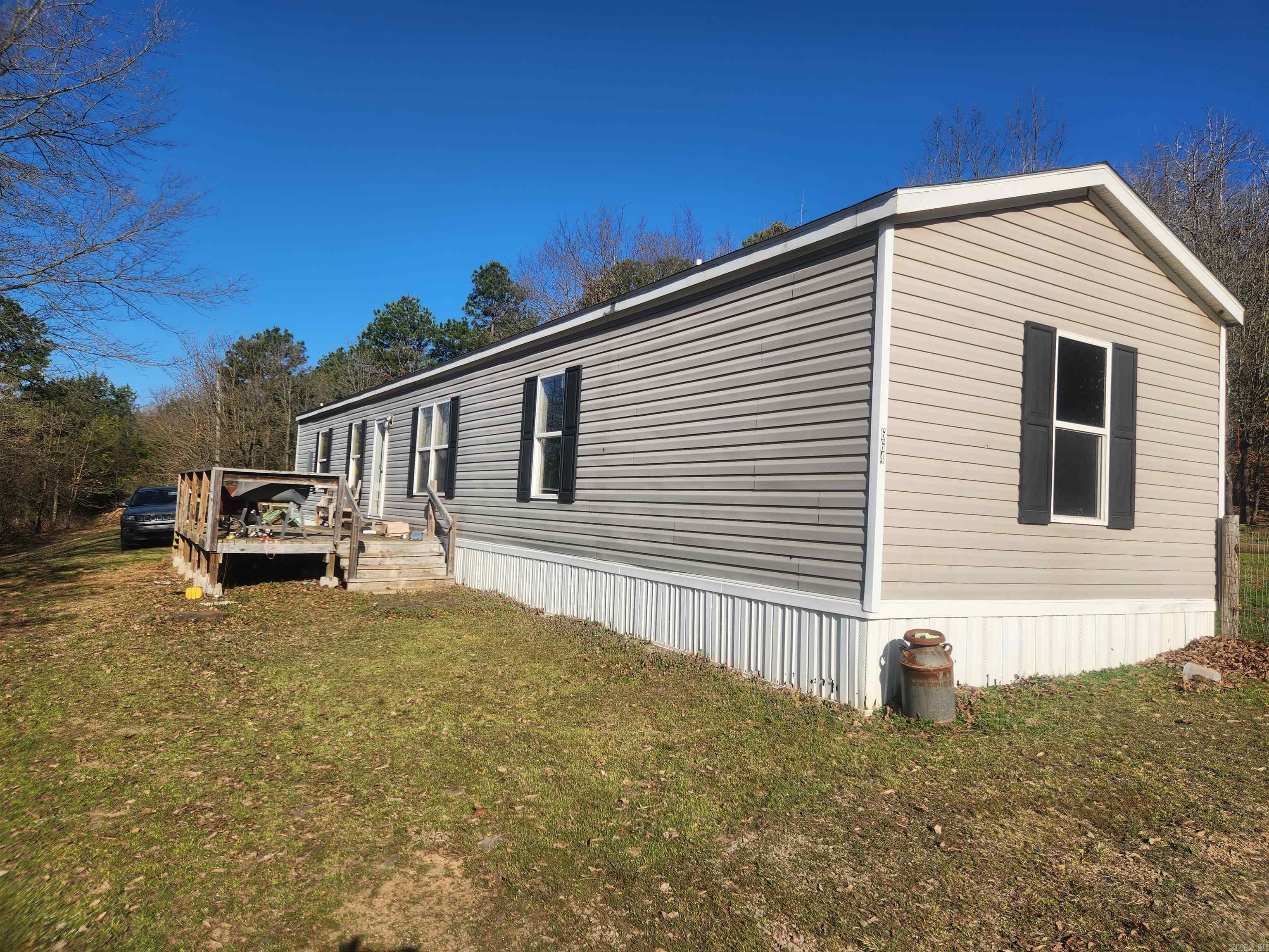 Discover this beautiful home site, perfect for a getaway, a hobby farm, or your place to sit on the deck and look at the sky and far off Mount Magazine, the highest peak in Arkansas. Everything is in great shape, from the mobile home, which is less than 10 years old to the spacious 10 x 24 Dirksen building. Inviting decks both at the front and back, make it the perfect place to enjoy the serene outdoors. If you're a nature lover, this secluded home offers lots of privacy, lots of wildlife, lots of opportunities to live the dream! located just a few miles from Horsehead Lodge