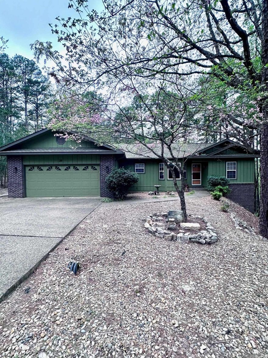 Privacy & Seclusion with Modern Updates! This 3-bedroom, 2-bath home offers a peaceful setting with a level driveway and lot, plus a secluded backyard filled with wildlife. Inside, enjoy a split floor plan with vaulted ceilings, hardwood flooring, fresh paint, and new carpet in the bedrooms. The kitchen features a new range and microwave, and all appliances convey for added convenience. A cozy, heated and cooled sunroom with walls of windows provides year-round enjoyment. Step outside to a newly remodeled multi-level back deck—perfect for relaxing or entertaining. Additional features include a workshop in the garage and a walkout basement with ample storage that could be finished to create additional living space. Conveniently located near Coronado Lake, boat ramp, Coronado Fitness Center, trails, Coronado Event Center and Library, with easy access to multiple gates thanks to its central location.