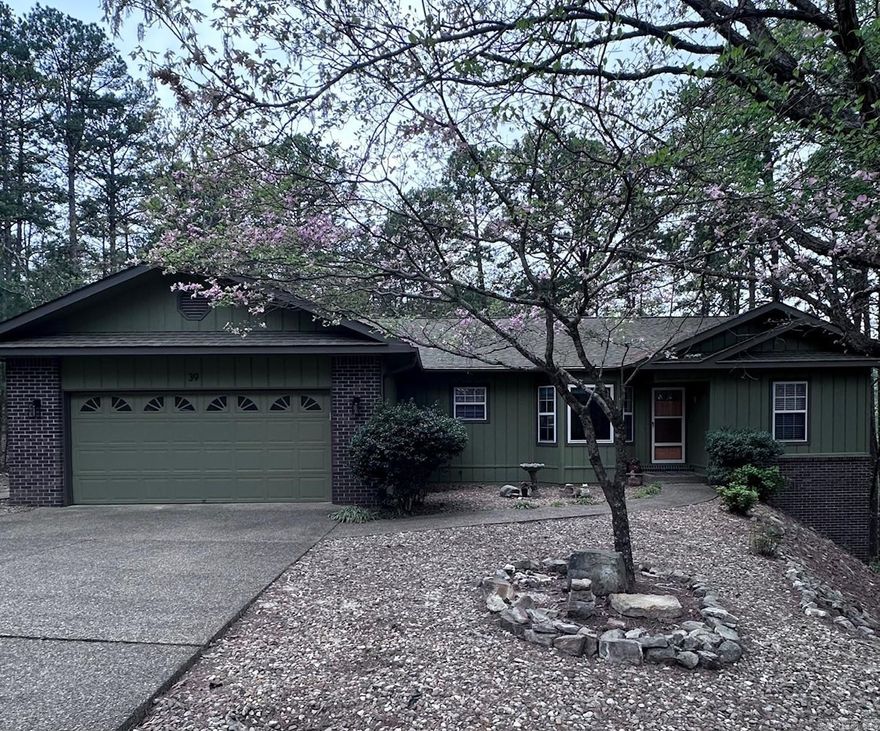 Privacy & Seclusion with Modern Updates! This 3-bedroom, 2-bath home offers a peaceful setting with a level driveway and lot, plus a secluded backyard filled with wildlife. Inside, enjoy a split floor plan with vaulted ceilings, hardwood flooring, fresh paint, and new carpet in the bedrooms. The kitchen features a new range and microwave, and all appliances convey for added convenience. A cozy, heated and cooled sunroom with walls of windows provides year-round enjoyment. Step outside to a newly remodeled multi-level back deck—perfect for relaxing or entertaining. Additional features include a workshop in the garage and a walkout basement with ample storage that could be finished to create additional living space. Conveniently located near Coronado Lake, boat ramp, Coronado Fitness Center, trails, Coronado Event Center and Library, with easy access to multiple gates thanks to its central location.