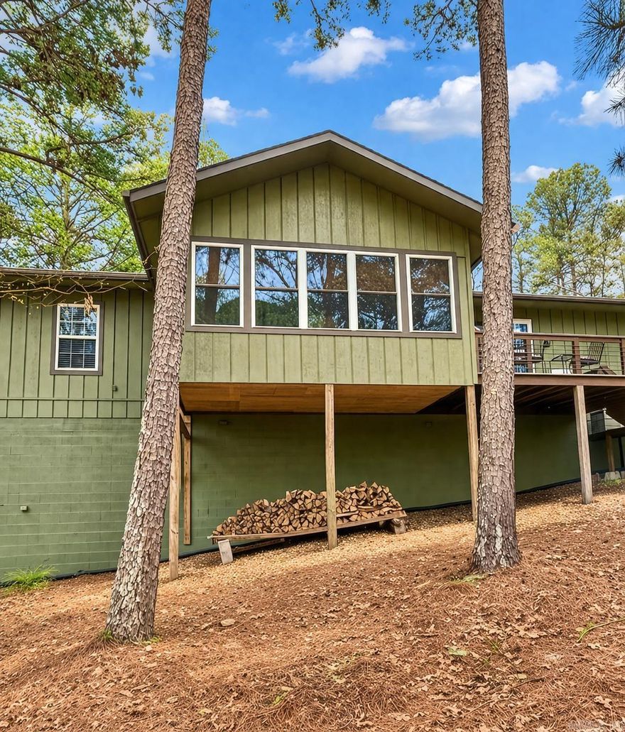 Private Retreat with Modern Updates – Ideal for Full-Time Living, Vacation Home, or Investment!  Tucked away in a peaceful, wooded setting, this 3-bedroom, 2-bath home offers privacy, seclusion, and strong potential as a primary residence, second home, or vacation rental. The level driveway and lot provide easy access, while the secluded backyard offers a tranquil escape with wildlife.  Inside, the split floor plan features vaulted ceilings, hardwood flooring, fresh paint, and new carpet in the bedrooms. The kitchen includes a new range and microwave, and all appliances convey—making it move-in or rental ready. A heated and cooled sunroom with walls of windows provides year-round enjoyment.  Enjoy the newly remodeled multi-level deck, plus a garage workshop and walkout basement with expansion potential. Located near Coronado Lake, boat ramp, fitness center, trails, golf, pickleball, dining, and more.