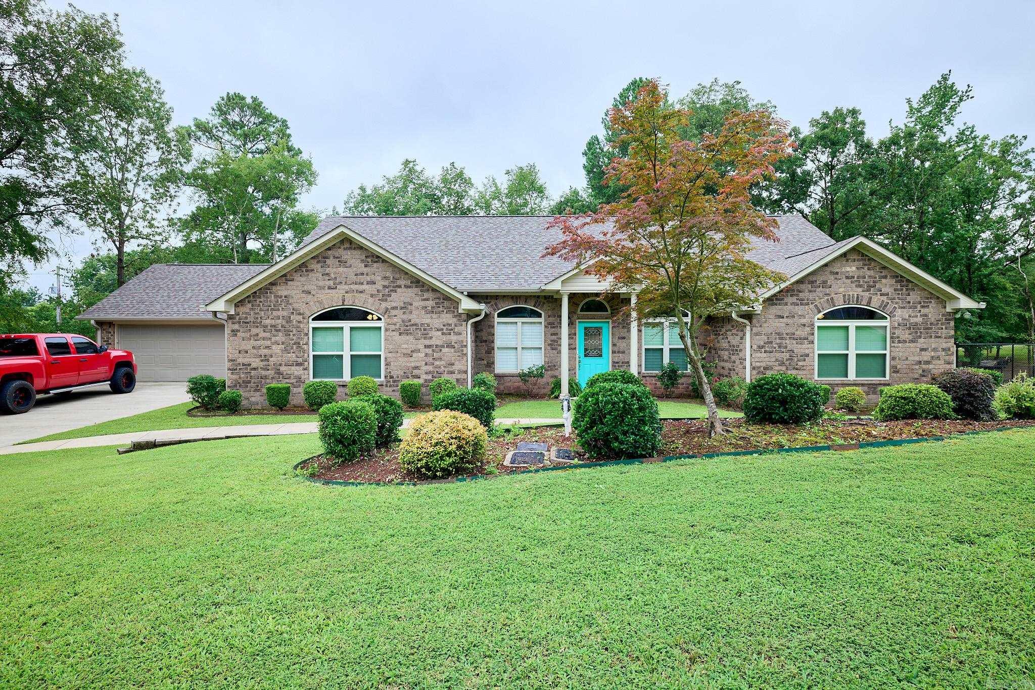 Nestled in the desirable Tanglewood Estates Phase II with exclusive Lake Hamilton access just steps awayāthis impeccably maintained 4-bed, 2-bath home offers the perfect blend of style and comfort. Built in 2016, this bright and spacious home spans 2,606 sqft on a generous 0.67-acre lot, including an extra parcel partially fencedāideal for pets. Thoughtfully designed layout features a welcoming great room with a wood-burning fireplace, elegant plank tile floors, and striking wooden barrel ceilings extending through the kitchen, dining, and living areas. Beautifully appointed kitchen and baths showcase custom cabinetry, stainless-steel appliances, and sleek granite countertops. The main bath invites indulgence with a walk-in shower, whirlpool tub, granite double vanitiesāplus an ensuite walk-in closet. Private and peaceful, the rear yard boasts privacy fencing, a covered automatic standby generator, and a large deckāperfect for entertaining. 2-car garage Security system and monitored smoke detectors Located in Lakeside School District Enjoy deeded access to Lake Hamilton via a private boat ramp just across the street.