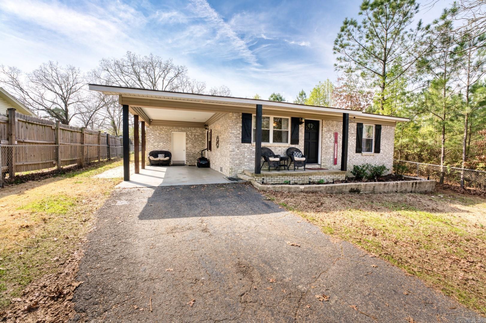 Tucked away in a quiet neighborhood just minutes from Oaklawn Racing Casino Resort. Three bedroom two bath with a patio area perfect for entertaining. Fenced in back yard with storage building. Check it out before it's gone.