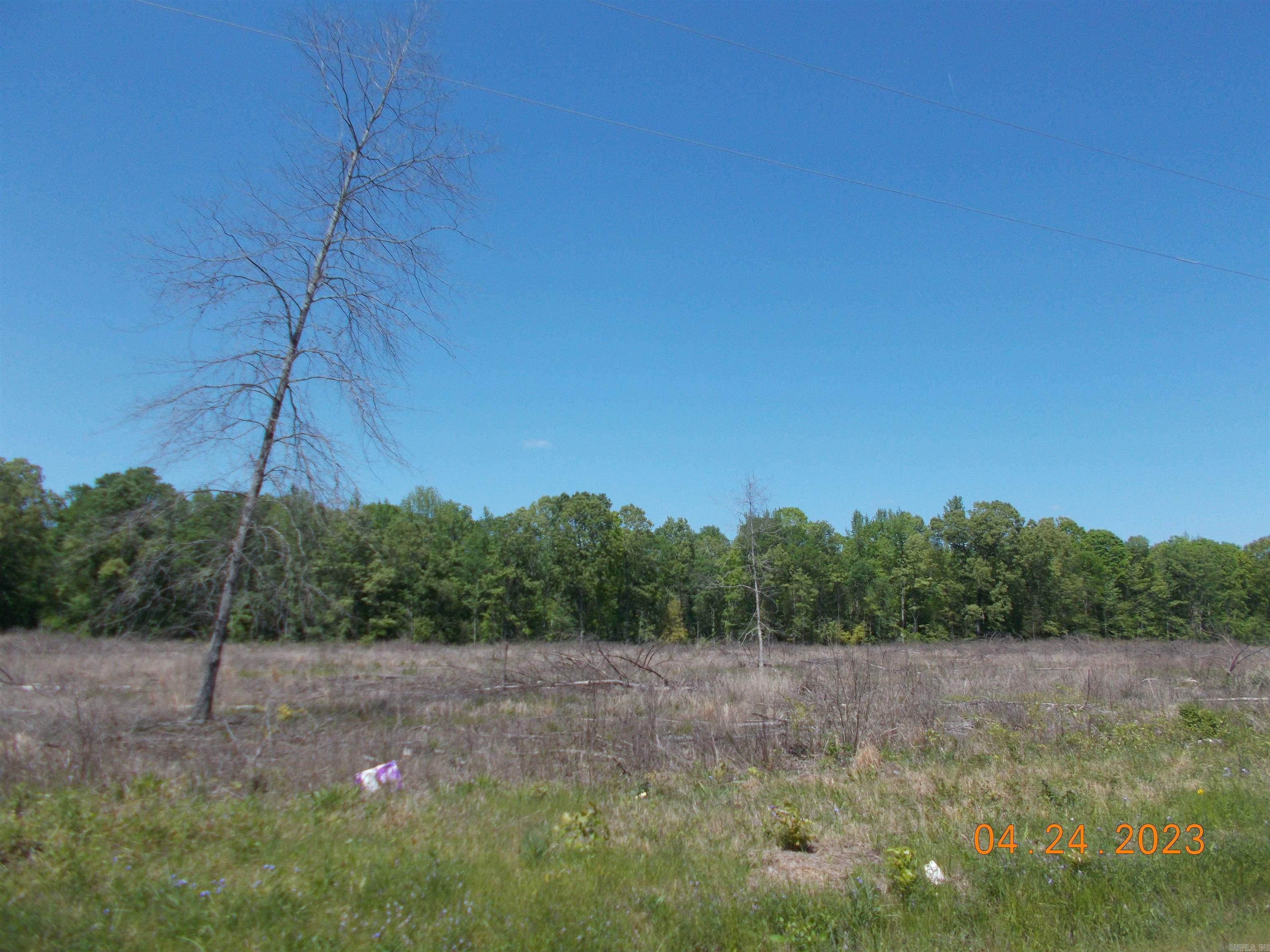 Property narrow but deep in layout. Wet weather creek toward back. Front half of tract was cut about 3 years ago. Has been prelim perked (letter in documents) Restricted to houses with mininum square footage of 1000 sf. (deed restrictions in documents) Sardis Water available at road, Electricity at road, Windstream/Go Kinetic fiber internet and gas is to the east and might be able to be extended....would need to contact Summit Utilities. No manufactured/mobile home that is five (5) years or older from the date on which it was manufactured will be allowed on any tract or parcel/lot.