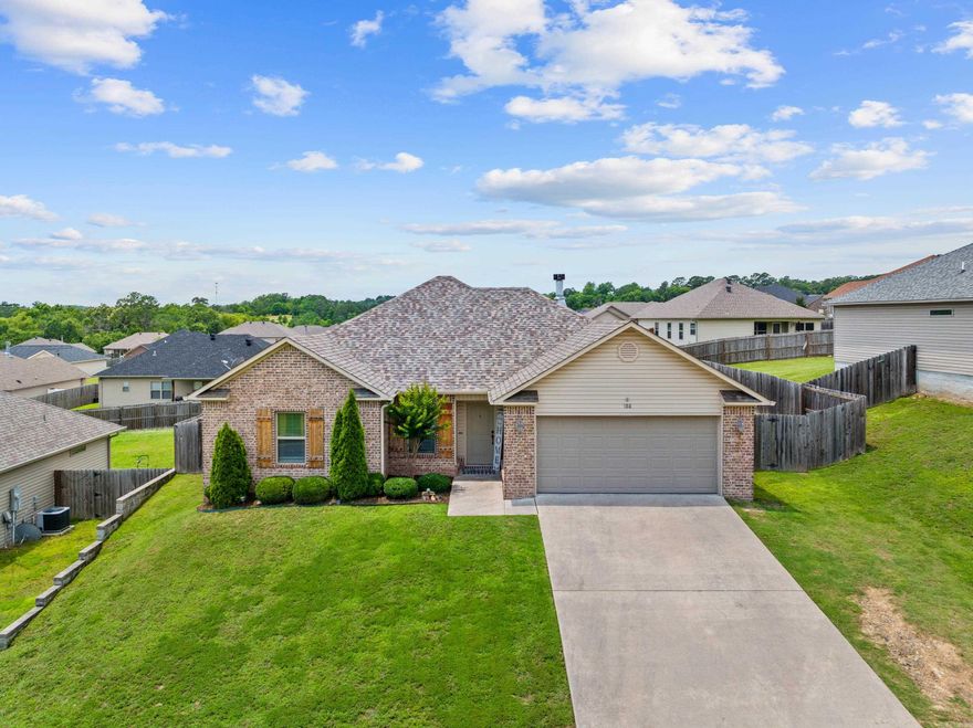Nestled in the charming Lake Hamilton school district, this exquisite 3-bedroom, 2-bathroom home epitomizes modern elegance and comfort. As you step into the inviting open-concept living space, you'll be greeted by a seamless flow from the dining area to the kitchen and living room, creating the perfect environment for entertaining and family gatherings. The well-appointed kitchen features stylish cabinetry, sleek countertops, and modern appliances. The abundance of natural light accentuates the warm tones of the wood flooring, creating a welcoming ambiance throughout the home. The spacious primary suite is a true retreat, boasting ample space for a king-sized bed, a cozy sitting area, and a luxurious ensuite bathroom. The ensuite bathroom is a haven of relaxation, featuring a soaking tub, a separate shower, and dual vanities, offering a spa-like experience at the end of a long day. he spacious, fenced-in backyard provides a safe and private area for children and pets to play. This exceptional property offers a unique combination of style, comfort, and location. Don't miss out on the opportunity to make this house your new home.