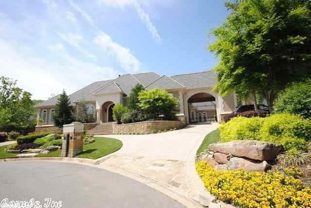 Custom built for the current owners, this one story home features a foyer, formal living room & dining room, kitchen, laundry, informal dining, hearth room, home office/library and four bedroom suites. The oversized master suite has a fireplace, master bath, fitted closet and exercise room.There is a separate media room with fireplace and beverage center. The attic (2,791 sq.ft.) was designed to be finished, should additional living space be needed. The fenced grounds feature a pool, pool house and pond.