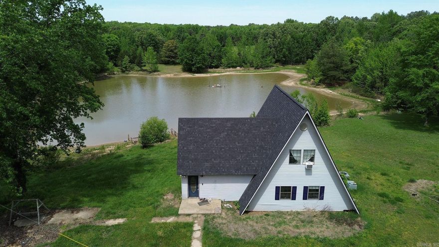 Tucked away at the end of a quiet road, this unique A-frame home sits on 14.9 acres of peaceful, private land—offering the perfect blend of seclusion and opportunity. The property features a beautiful 2-acre pond stocked with fish, ideal for relaxing afternoons or outdoor recreation. The three-story home is currently mid-remodel, giving you the chance to finish it out exactly to your style and needs. A new roof was installed in 2025, providing a solid start for completing the project. Step out onto the deck and take in the scenic views overlooking the pond—an ideal spot for morning coffee or evening sunsets. In addition, a 20X34 shop building with electricity offers excellent space for hobbies, storage, or a workshop. With its scenic setting, abundant acreage, and endless potential, this property is perfect for those looking to create a custom retreat, investment opportunity, or country getaway.