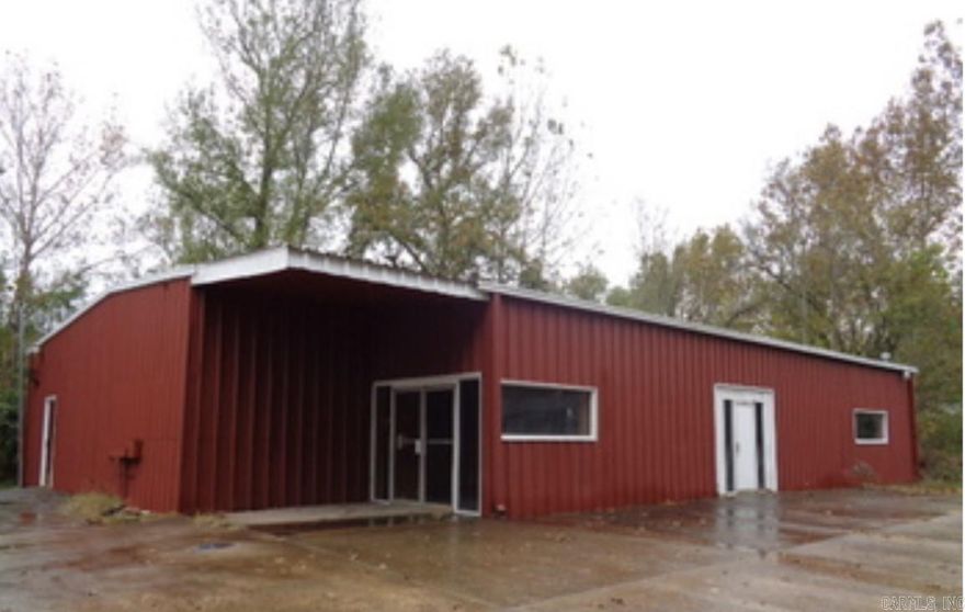 Excellent investment opportunity to fix and flip or locate your new or existing business. Currently built out as a bar, this building needs lots of TLC, but offers endless business possibilities. Also includes private living quarters with full bath. Sold As-Is. No repairs.