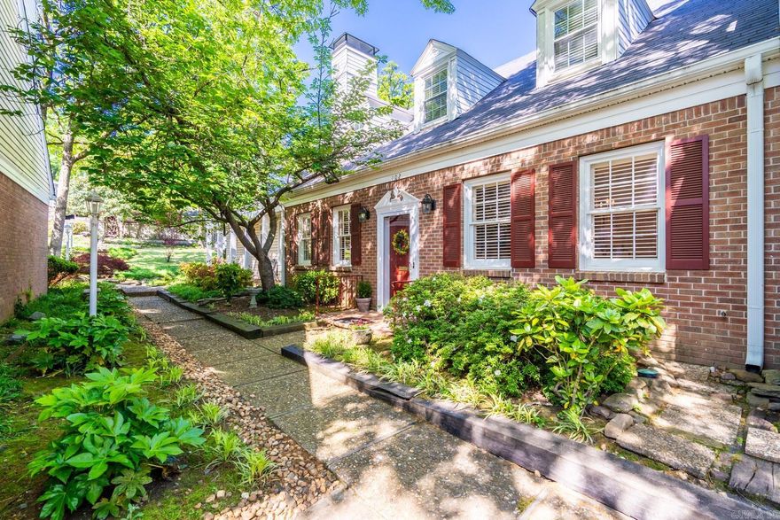 Meticulously maintained townhome tucked away in West Little Rock's Kingsbridge neighborhood. Featuring a Formal Living Room with super built-ins and a fireplace with gas logs that opens to a spacious Formal Dining Room, it also includes a storage closet perfect for all of your china. The Kitchen with Corian countertops has white cabinets and a breakfast bar and is open to the Den/Family Room with a fireplace with gas logs. Primary Bedroom is on the Main Level and has a private patio perfect for plants, double closets and a bath with a separate shower and tub. Nice half bathroom and Laundry closet downstairs with washer/dryer that convey. Upstairs are two large bedrooms that share a bathroom with tub/shower and great vanity area. Walk-in attic storage upstairs is fantastic. Rear load two car garage and an outside private patio/deck area. Condo Association Fee is $290/month (grounds, termite, garbage, exterior maintenance, fireplace check, pool). Insurance is paid directly to RPM Management $216/month (walls out). Owner also maintains insurance for interior (walls in) and personal property with insurance company of choice. Wonderful home with area pool, tennis courts and club house.