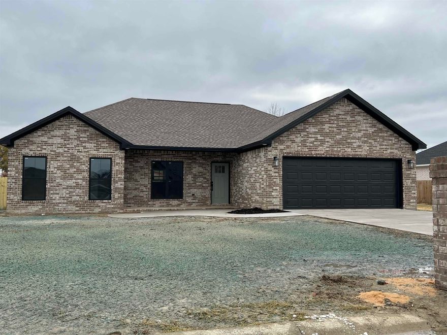 Brand new brick construction home with 3 bedrooms, 2 baths. Large backporch,2-car garage and fenced backyard. Large kitchen with island and plenty of cabinetry. Lots of storage space in the built in drop zone. The primary suite has a well designed closet and walk-in tiled shower and two separate vanities. 1225 Stella Lane Trumann AR is a great house plan, talk to your favorite Realtor for more information on it.