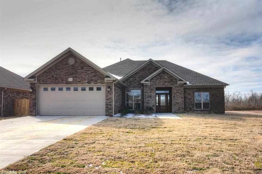 Fabulous four bedroom home features high end amenities including scraped hardwood floors, stained cabinets, granite counter tops in kitchen and bathrooms, jetted tub, separate shower, and more!  Enjoy entertaining on the covered back porch and private fenced in backyard.  Great neighborhood too...stocked fishing pond, sidewalks, AND future developer plans include a community swimming pool!  Convenient location too! A MUST SEE!