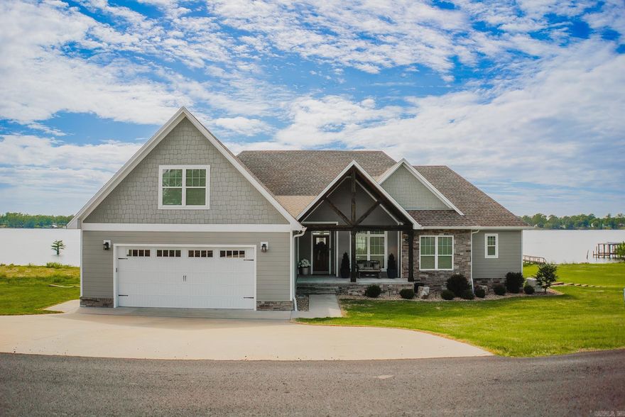 Lake Village, This One’s For YOU!!   This one is far from average and packed with upgrades inside and out! Sitting on approximately 2 acres, this home offers the perfect mix of comfort, style, and lake living.  Step inside to find quartz countertops throughout, soft-close cabinetry, and GE Profile stainless appliances. The home features tiled bathrooms, and a walk-in rain shower in the master. You’ll love the Cali Bamboo hardwood floors, along with built-ins in every closet and a large, floored attic for extra storage.  Outside is where this home really shines—featuring a composite dock, 50-year vinyl seawall, and your own concrete boat ramp, making lake life easy and enjoyable. The covered back patio with roll-down shade is perfect for relaxing or entertaining!! Generac Whole House Generator and Pynamite Bluetooth Mosquito System.   The 2-acre lot includes pecan and fruit trees, is landscaped for easy maintenance, and has outdoor outlets and multiple water spigots conveniently placed around the property. Don't miss the 1200 sq ft shop with heating and cooling, a half bath, storage, and garage access—perfect for hobbies or workspace.  Not your average home....and it shows!!