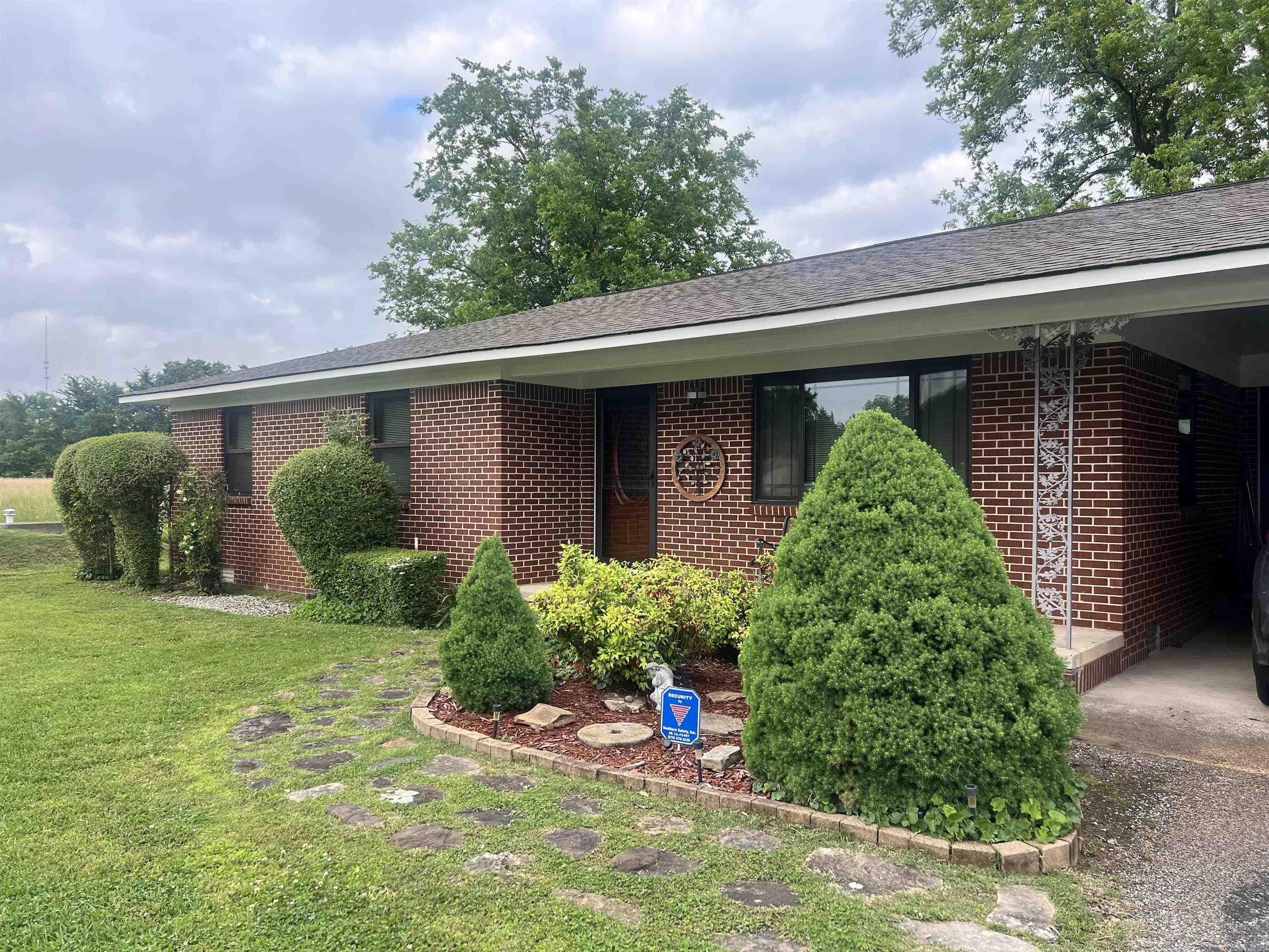 Very well maintained 3BR/1.5BA home with a double carport on a large corner lot in Newark. You'll find a spacious fenced back yard with Bald Eagle barn and small shed for lots of outdoor storage. The property has a storm cellar for your peace of mind and protection during Arkansas' crazy storm weather. Remodeling includes new laminate flooring, new paint, and new doors and hardware throughout the living room, hall, and master bedroom. Large utility room with newer washer and dryer to stay, plus extra storage room off the utility with an exit to the carport.