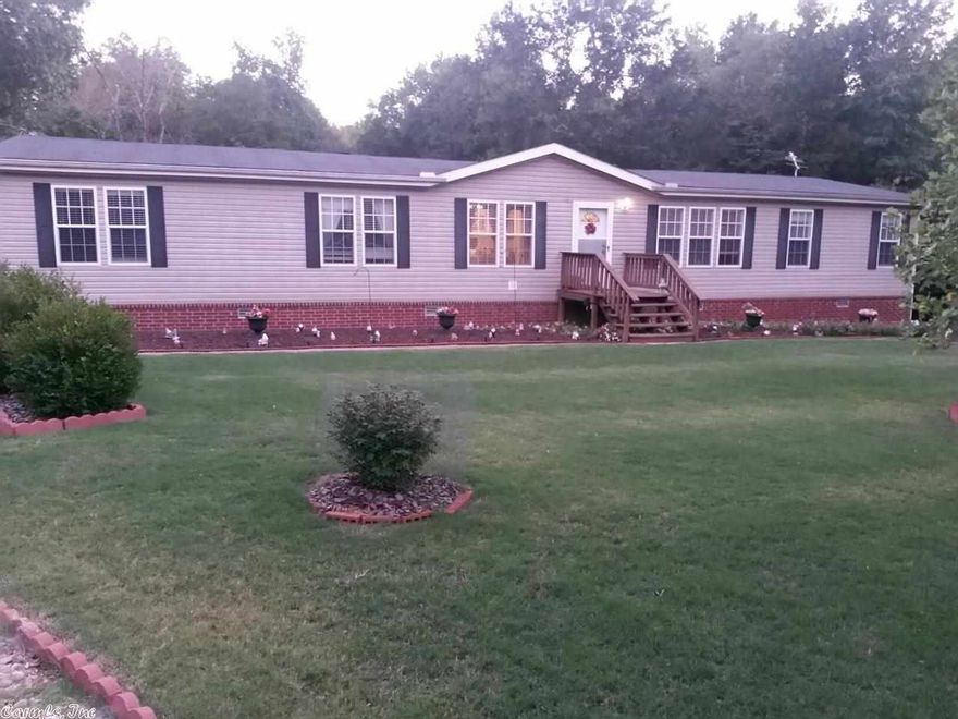 Immaculate, well-kept modular home on permanent foundation. Roomy 4 bed home with a split floor plan. There is a 16x20 and a 10x16 storage building on property, both of which have electricity.