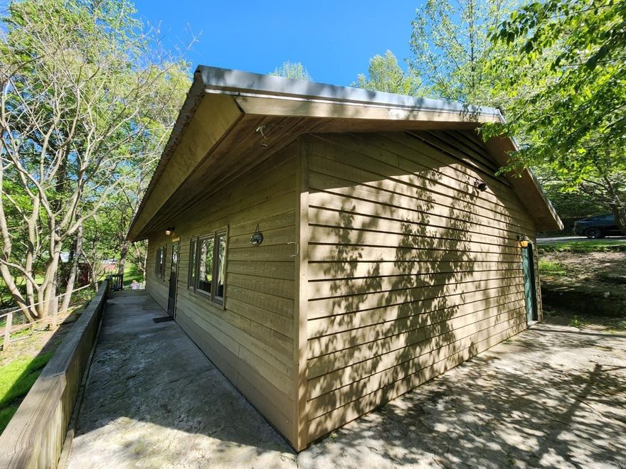 Lakeside cabin with a path down to the water, quiet area, well maintained, boat ramp nearby, nice large yard.