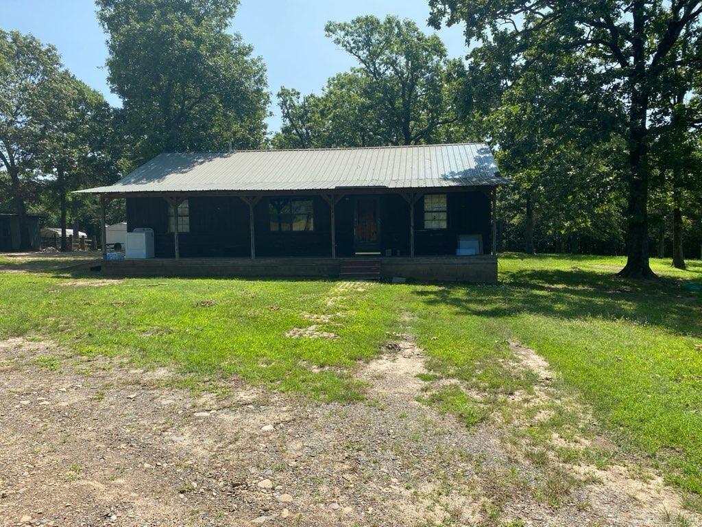 Mountain views abound from this five acre parcel with a home, just outside the city limits of Mena. Fixer upper will need some work, but has a front porch to enjoy the views. Central HVAC, some fences, shop, all on a paved road. Take a chance on this property and create your own little country retreat! Peaceful spot in the country, the house is nestled among trees....don't let this one get away from you! Agents see remarks.