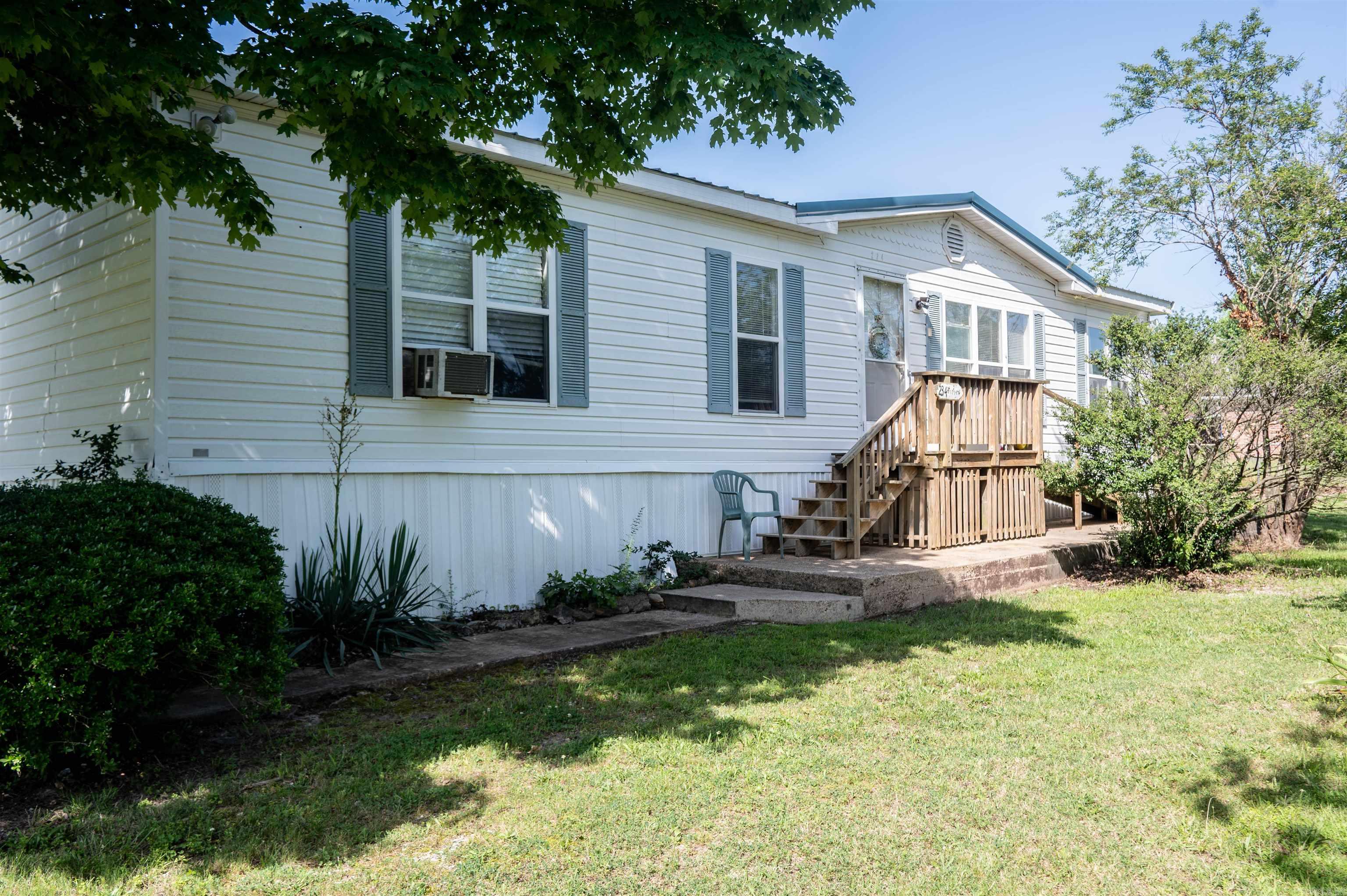 This well-maintained 3BD 2BTH double-wide home is packed with features for comfortable living. Recently updated with a new metal roof and a new furnace, both less than a year old, you can enjoy peace of mind knowing the major systems are like new. The spacious layout includes a large, covered back deck perfect for relaxing or entertaining, while a handicap-accessible ramp to the front door ensures ease of access for all. Securely tied down and ready to make your own, this home combines functionality and charm in one affordable package!